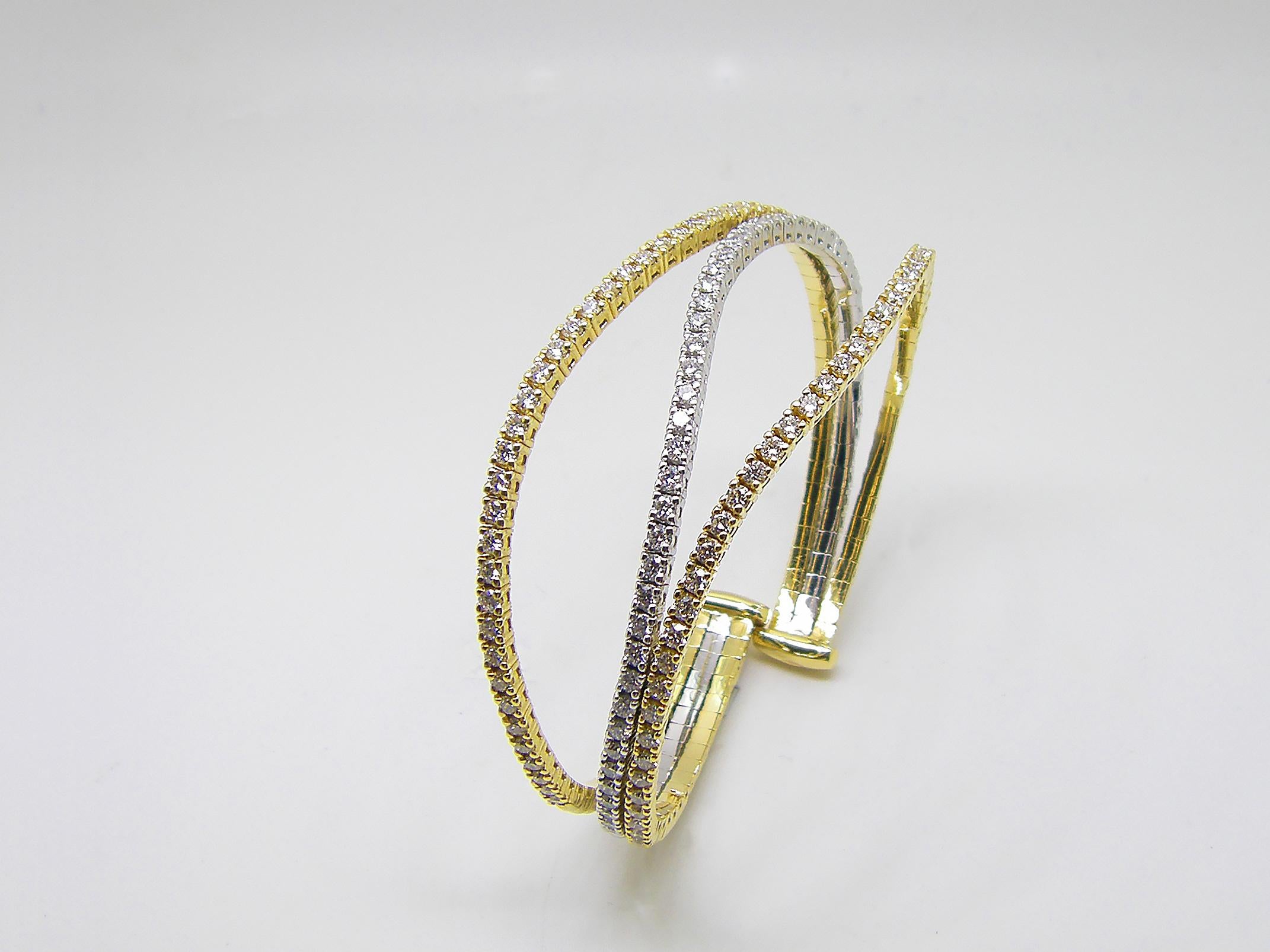 S.Georgios designer flexible bangle cuff bracelet is custom made of Yellow and White gold 18 karats. The gorgeous cuff has brilliant cut white diamonds total weight of 3.52 Carat set microscopically.
We also make this stunning piece in all White,