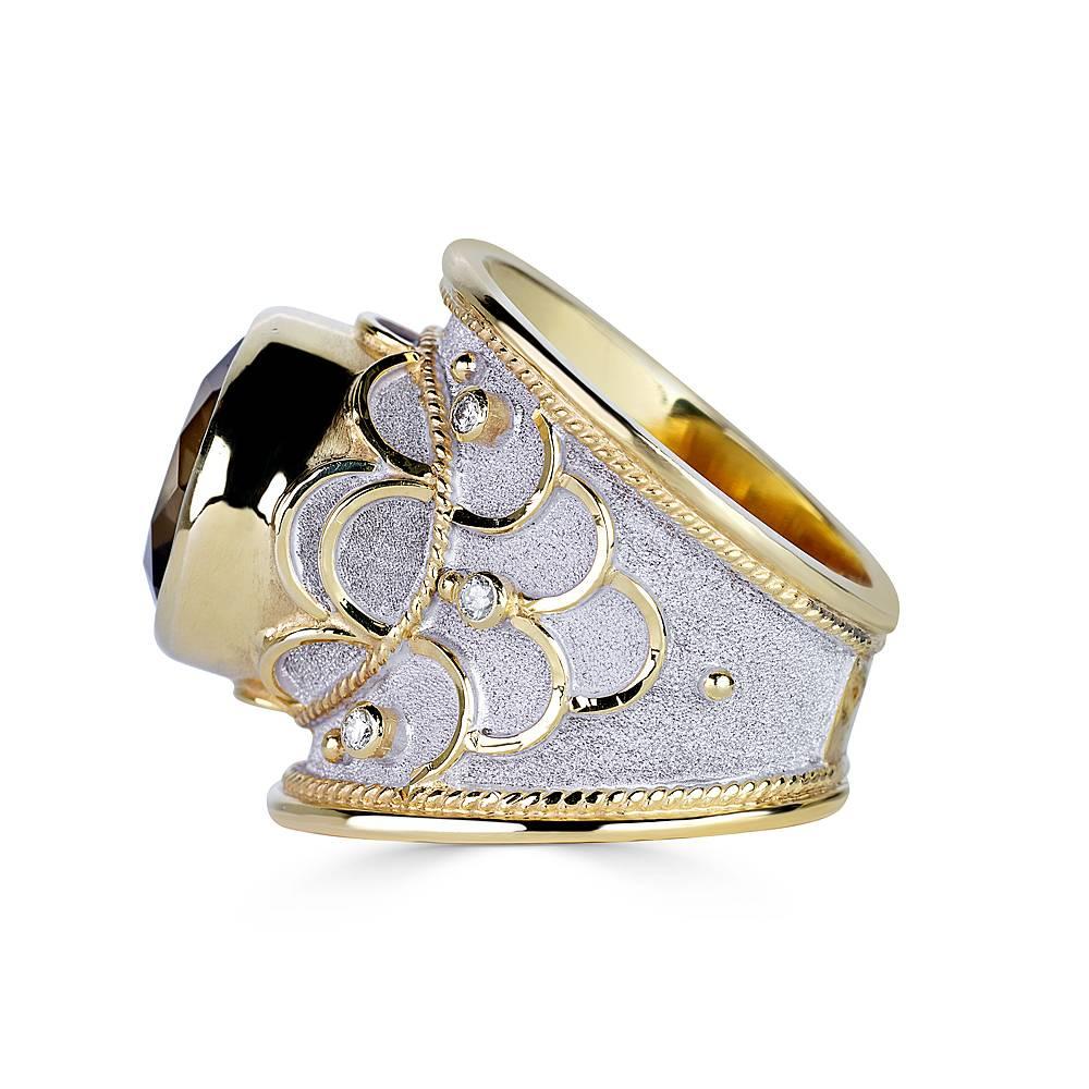 One of a kind S.Georgios designer ring in solid 18 Karat Yellow Gold all handmade with the Byzantine workmanship - granulation work microscopically decorated over the unique velvet effect background with white rhodium oxidization.
Center of the ring