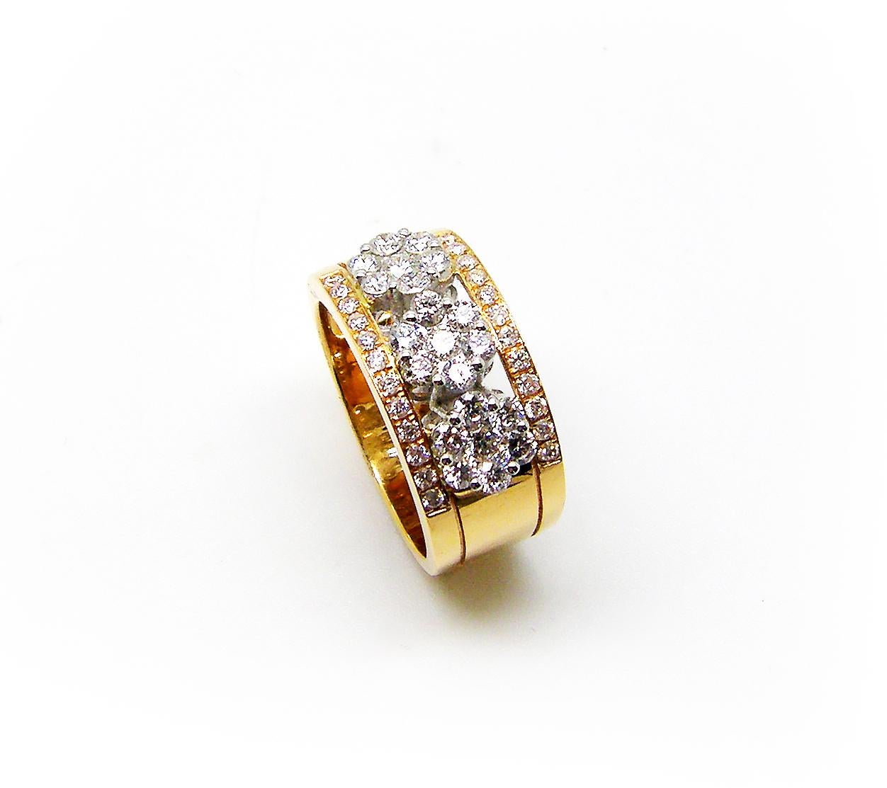 S.Georgios designer 18 Karat Yellow Gold Two-Tone Diamond Band Ring is all handmade and has three white gold diamond flowers in the center. The gorgeous band features brilliant cut white diamonds total weight of 1.00 Carat in a microscopic