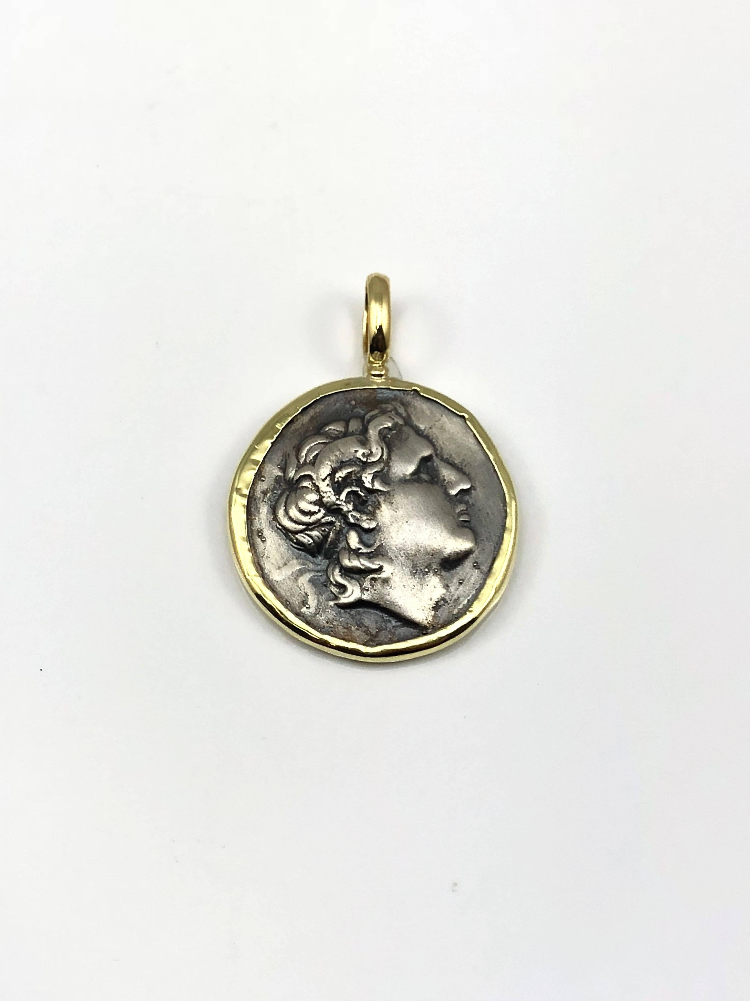 S.Georgios designer 18 Karat Yellow Gold handmade Pendant Necklace featuring a replica of an Ancient Greek Alexander The Great Coin in Silver 925. The beautiful coin has a reverse side and can be worn both ways and the rim and hook of the pendant