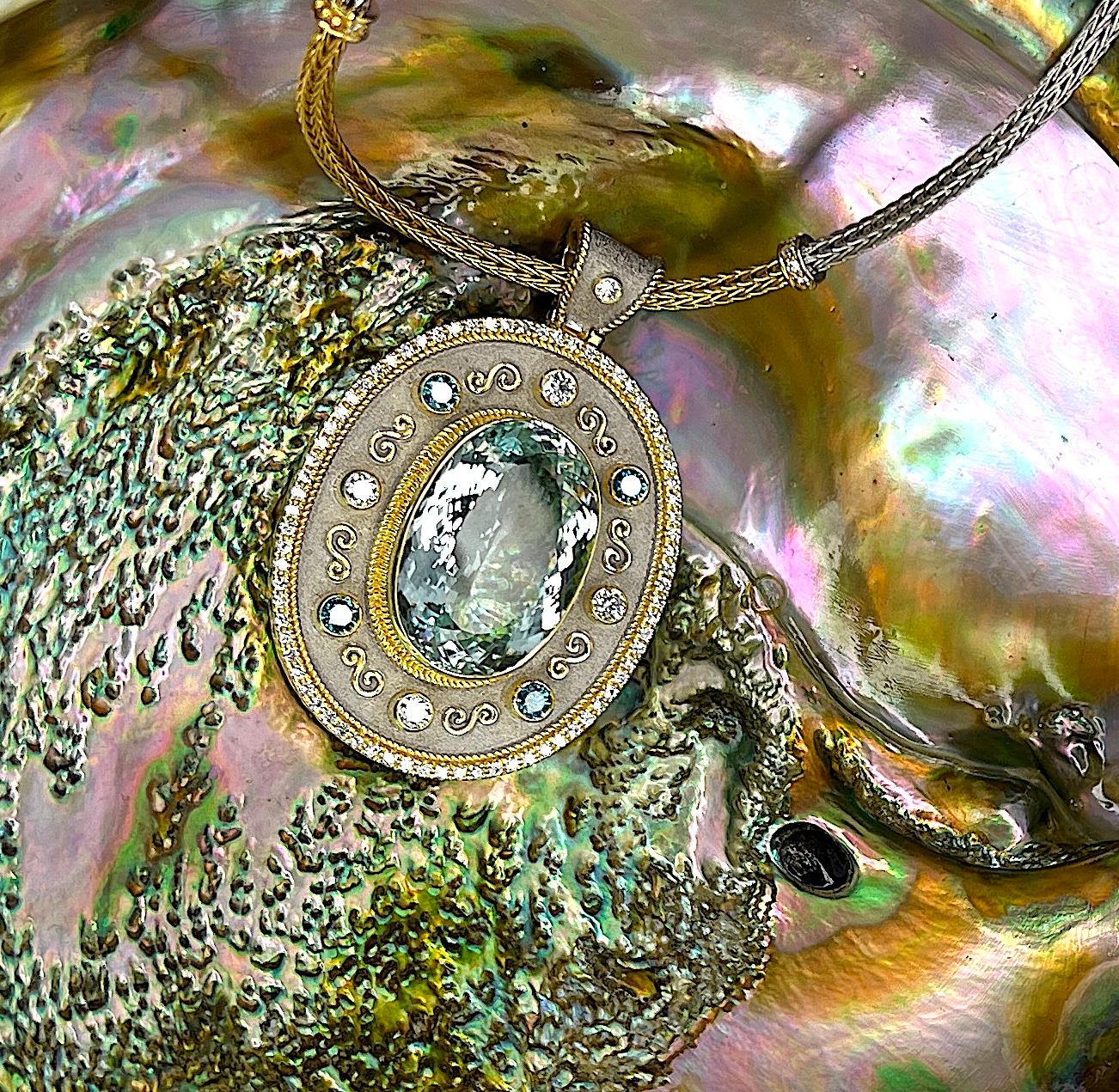 This S.Georgios designer pendant enhancer is handmade from 18 Karat yellow gold and finished with White Rhodium. It is microscopically decorated with granulation work - twisted wires on a gorgeous and unique velvet background. This pendant enhancer