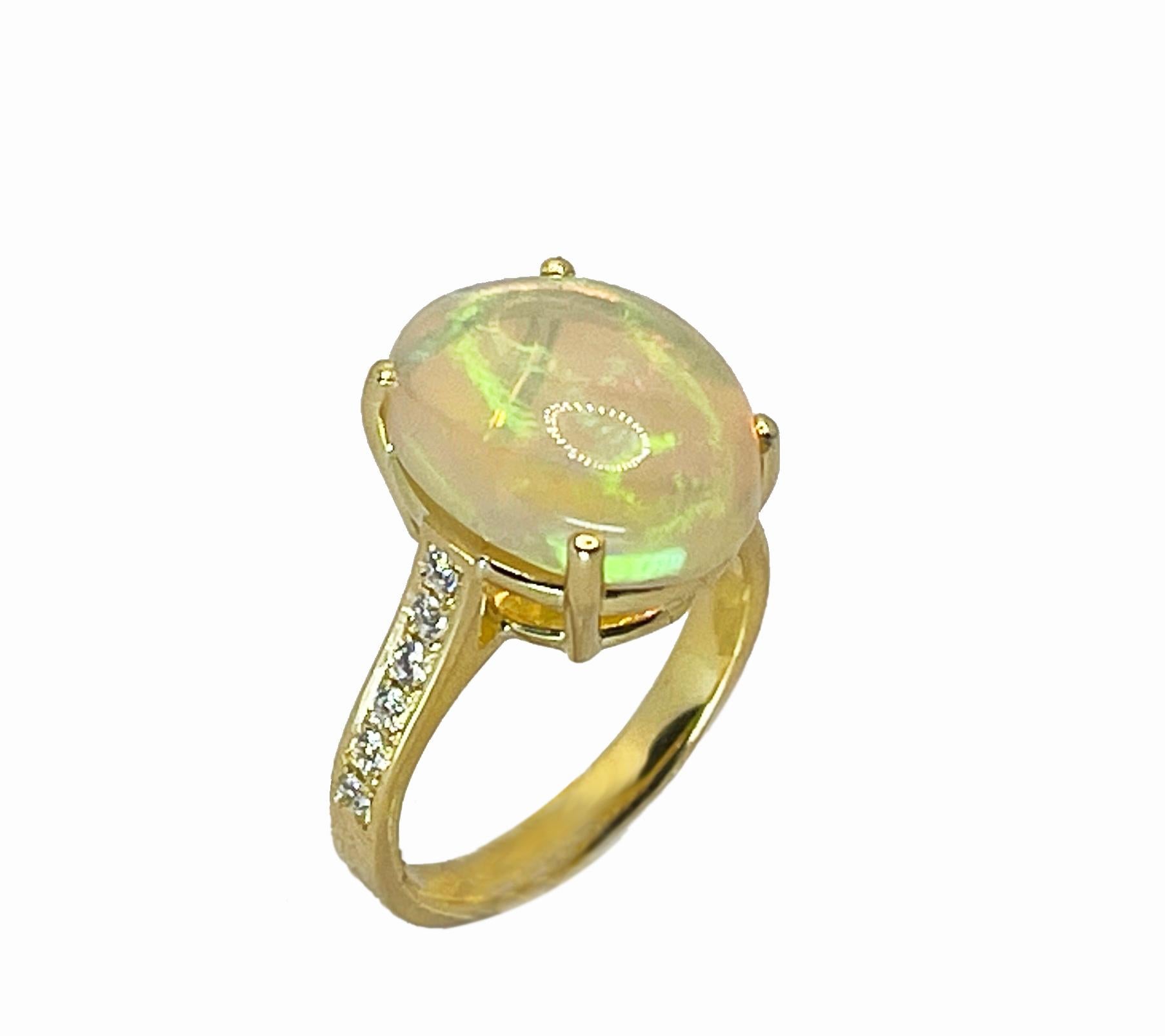 This S.Georgios designer 18 Karat Yellow Gold Natural Australian Opal ring is all custom made by hand and features a stunning cabochon cut Natural beautiful color Opal total weight of 4.48 Carat. We have accented this gorgeous Opal art piece with 12