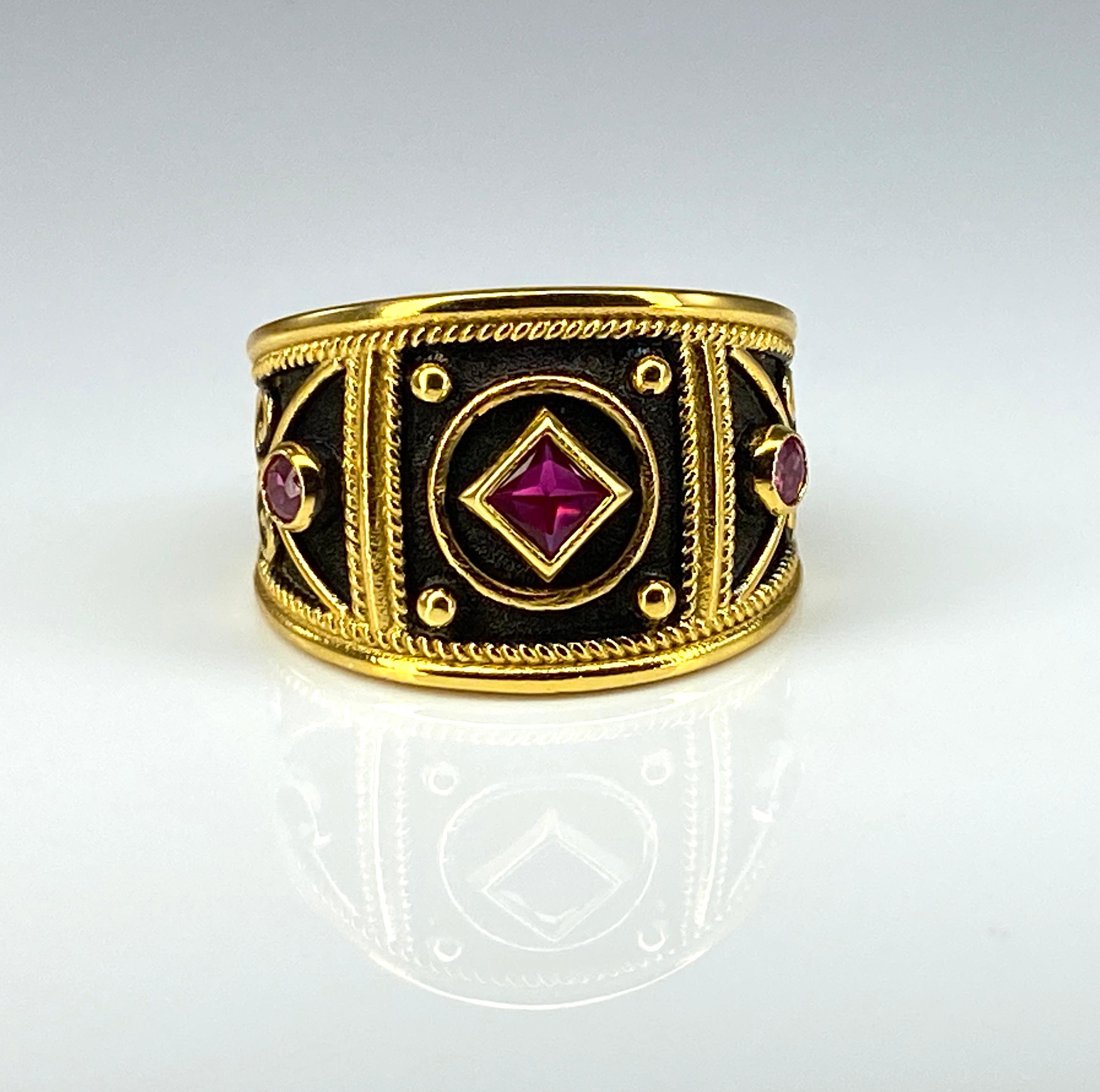 Presenting S.Georgios designer 18 Karat Solid Yellow Gold Ring handmade in a Byzantine Style workmanship with a unique velvet background finished with Black Rhodium. This graduated ring with a big display is decorated with granulation and princess