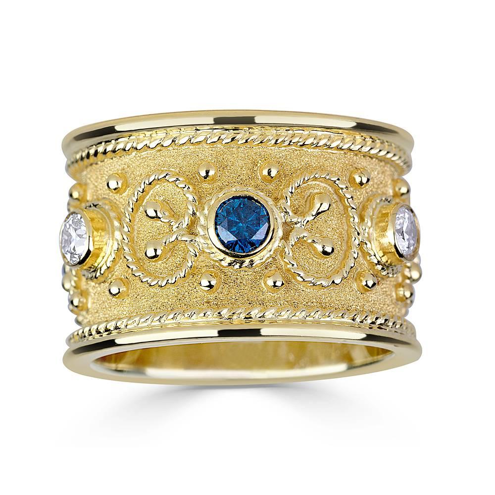 S.Georgios design Band Ring is handmade from 18 Karat Yellow Gold and microscopically decorated- granulations all the way around with gold beads and wires shaped like the last letter of the Greek Alphabet - Omega, which symbolizes eternal life. 