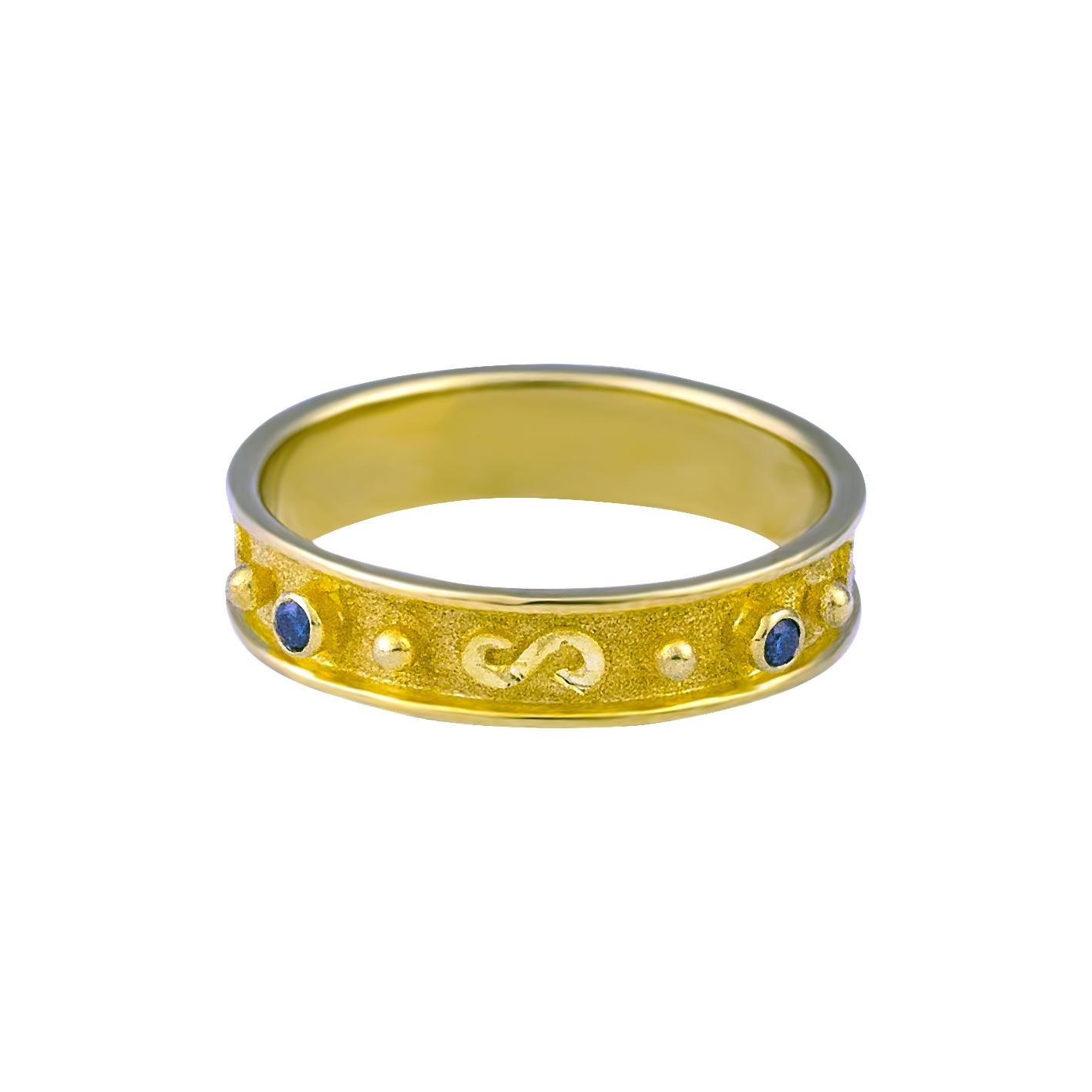 S.Georgios design Ring is handmade from solid 18 Karat Yellow Gold and is microscopically decorated with Granulation work all the way around with white gold beads and wires shaped like the symbol of long life, the Greek Key Design. This beautiful