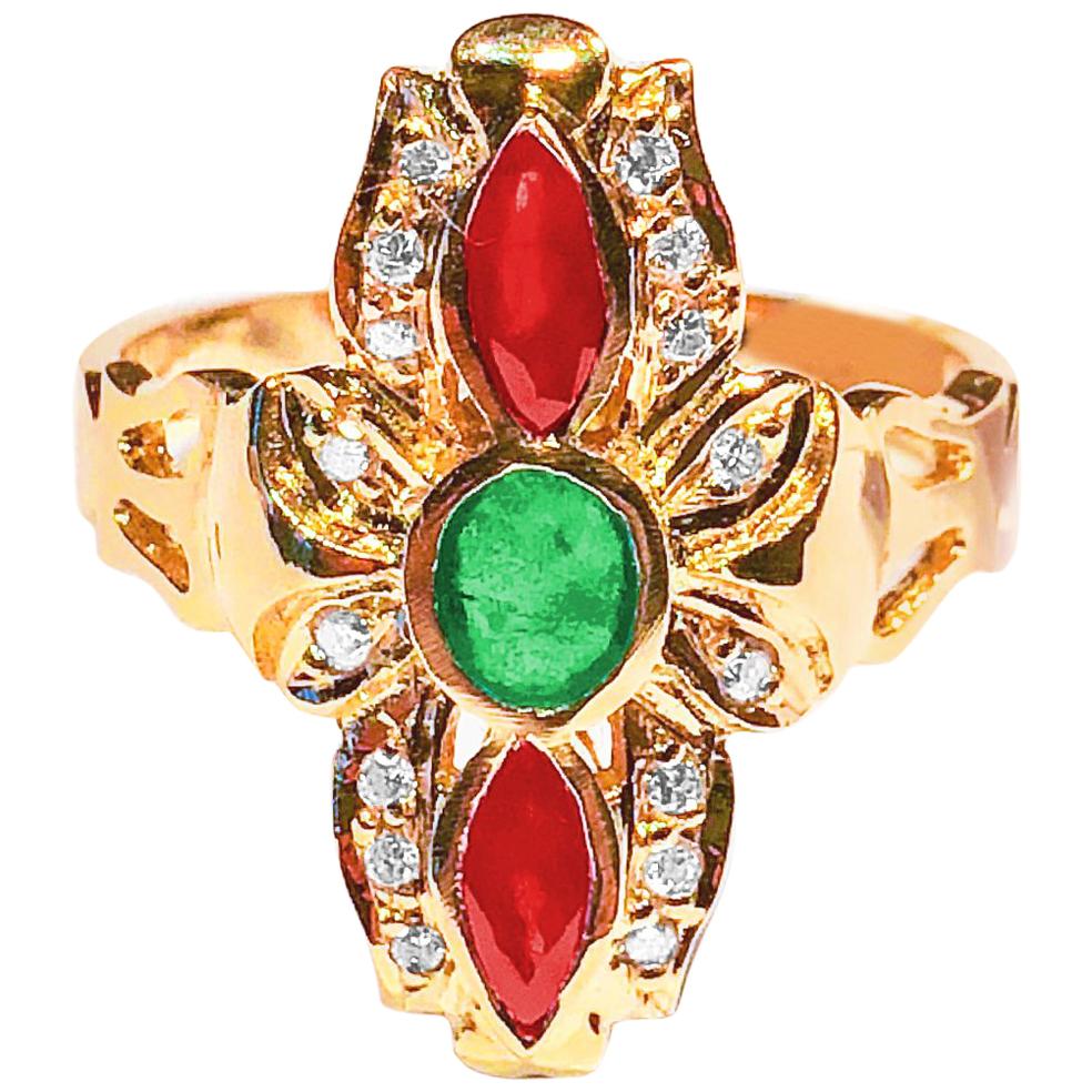 S.Georgios Hand Made 18 Karat Yellow Gold Ring decorated with Byzantine-era style Granulation and a combination of Diamonds, Rubies, and an Emerald
The Ring features Brilliant cut Diamonds total weight of 0.18 Carat, an oval Emerald in the center,