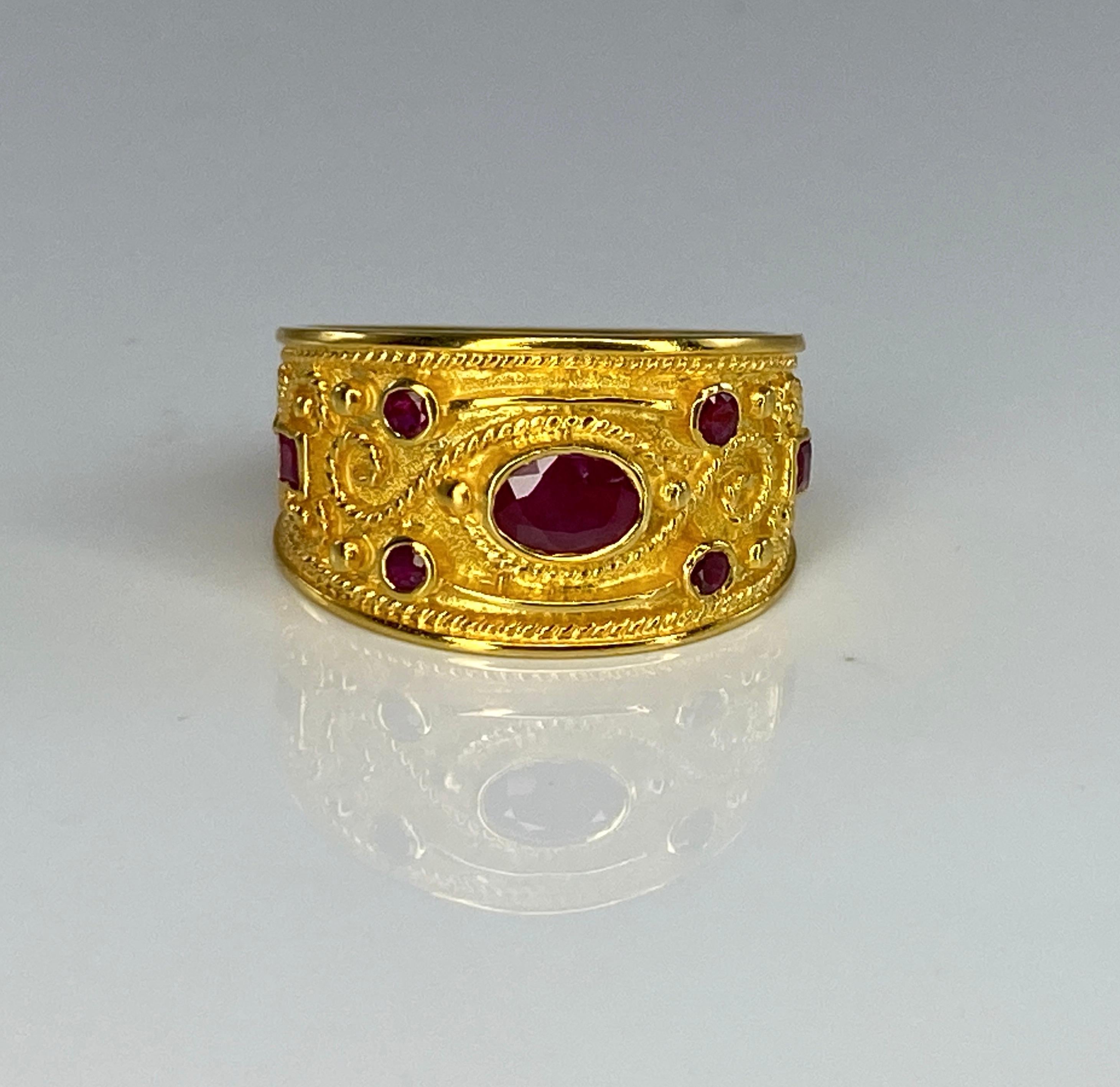 Presenting S.Georgios designer 18 Karat Solid Yellow Gold Ring all handmade with the Byzantine Style workmanship and a unique velvet background decorated with princes oval and round cut Rubies of a total weight of 1.04 Carat and 2 Brilliant cut