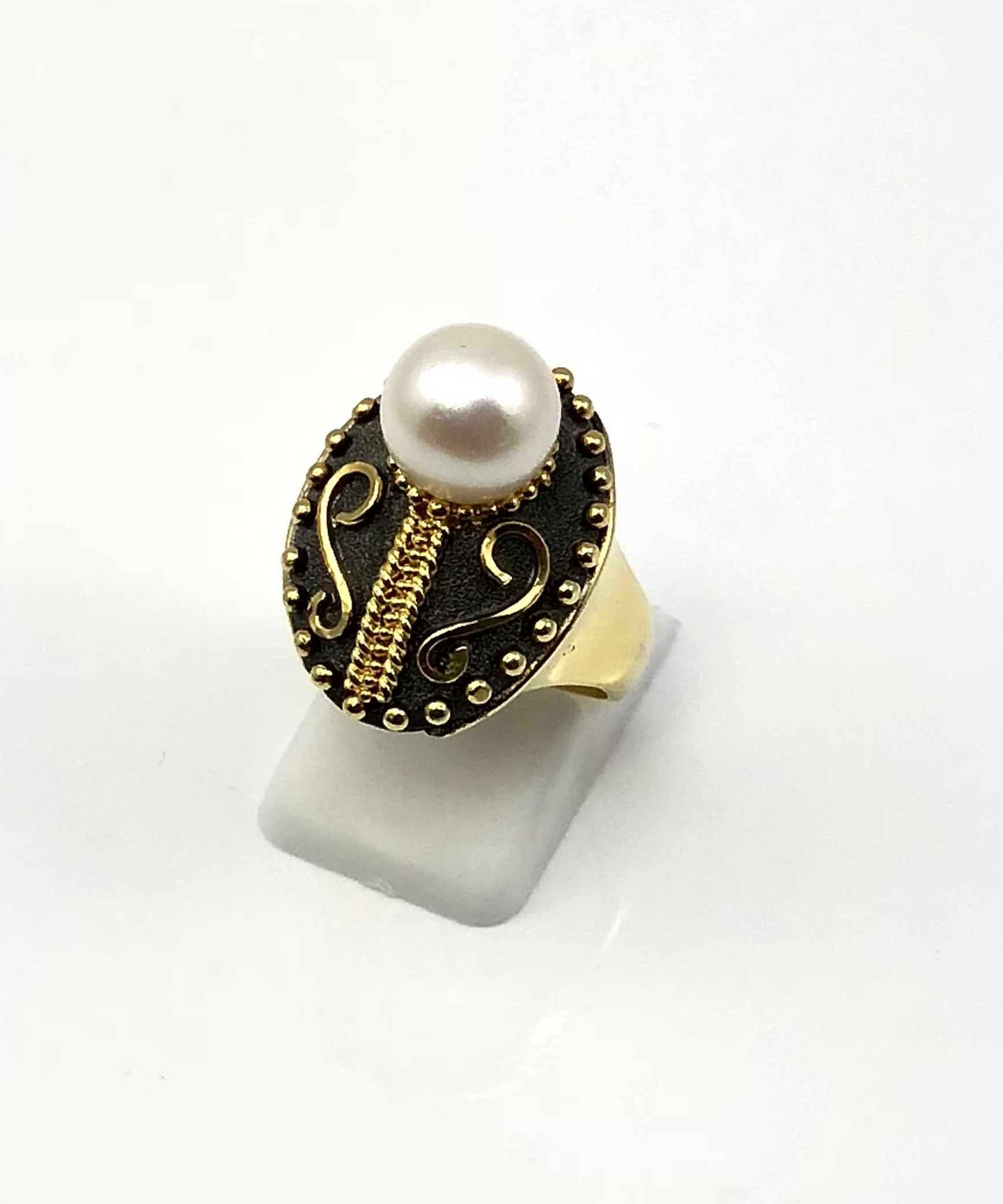 S.Georgios designer ring is all handmade from solid 18 Karat Yellow Gold and custom-made. This Byzantine-style ring is microscopically decorated with granulation work - with gold beads and wires, and a Black Oxidized Rhodium velvet background. This