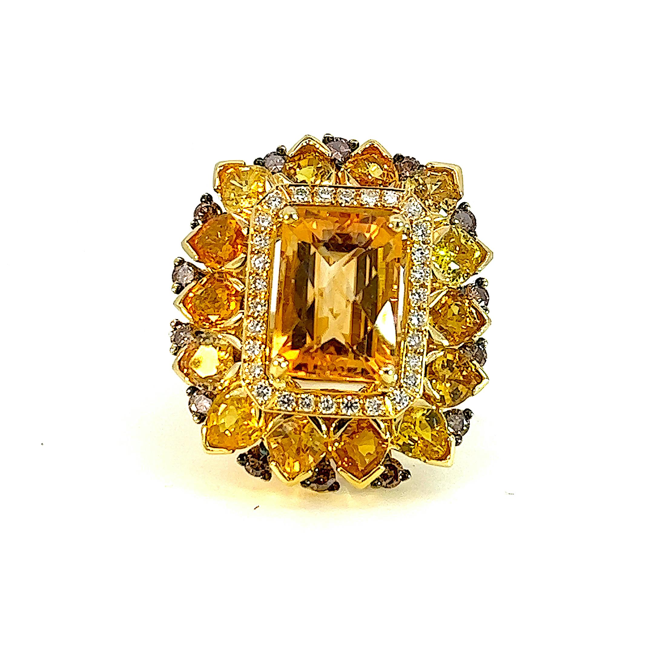 This sunshine stunning ring from S.Georgios designer was handmade in our workshop in Greece from solid 18 Karat Yellow Gold. The ring features 9.7 Carats of Faceted Citrine center surrounded by 10.1 Carats of pear-cut sapphires, a row of Brilliant