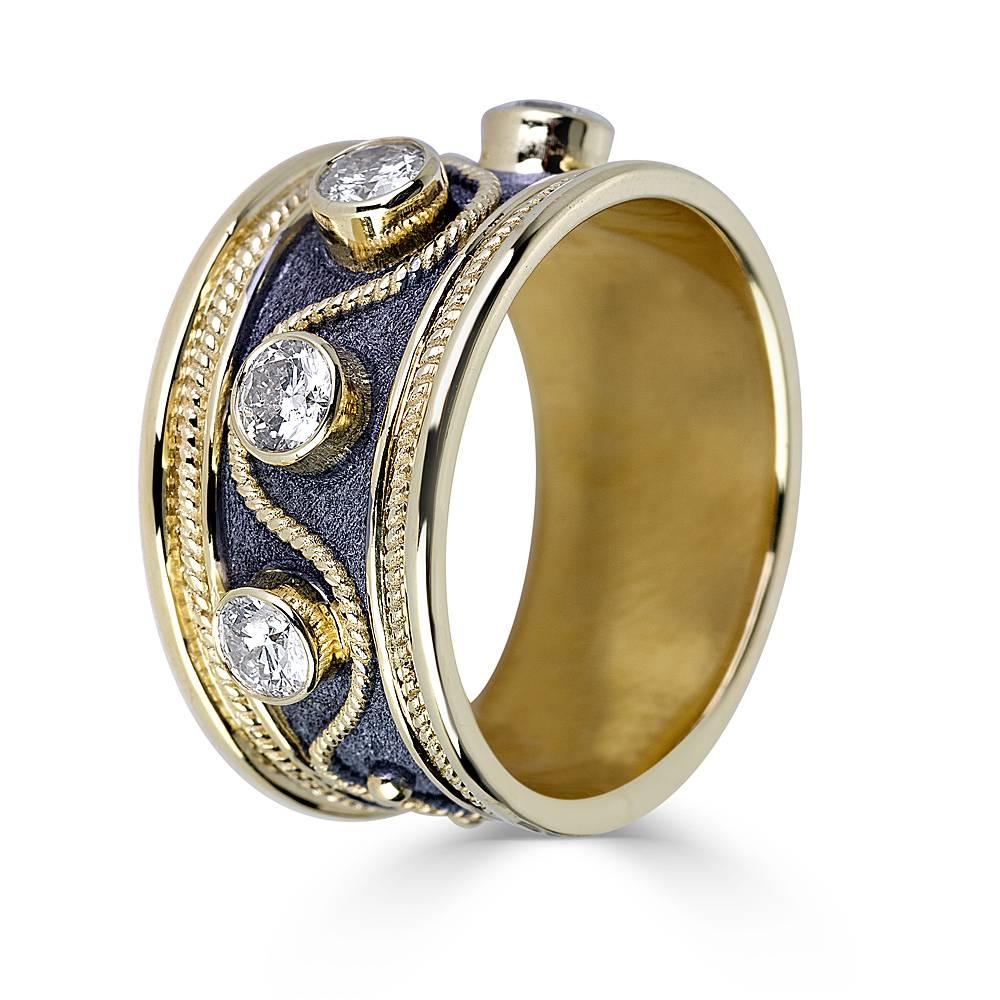 S.Georgios design ring is all handmade from solid 18 Karat Yellow Gold and has decorations in 22 Karat Gold granulation work in Byzantine style and a unique Velvet look on the background finished with Black Rhodium. This gorgeous piece features 5