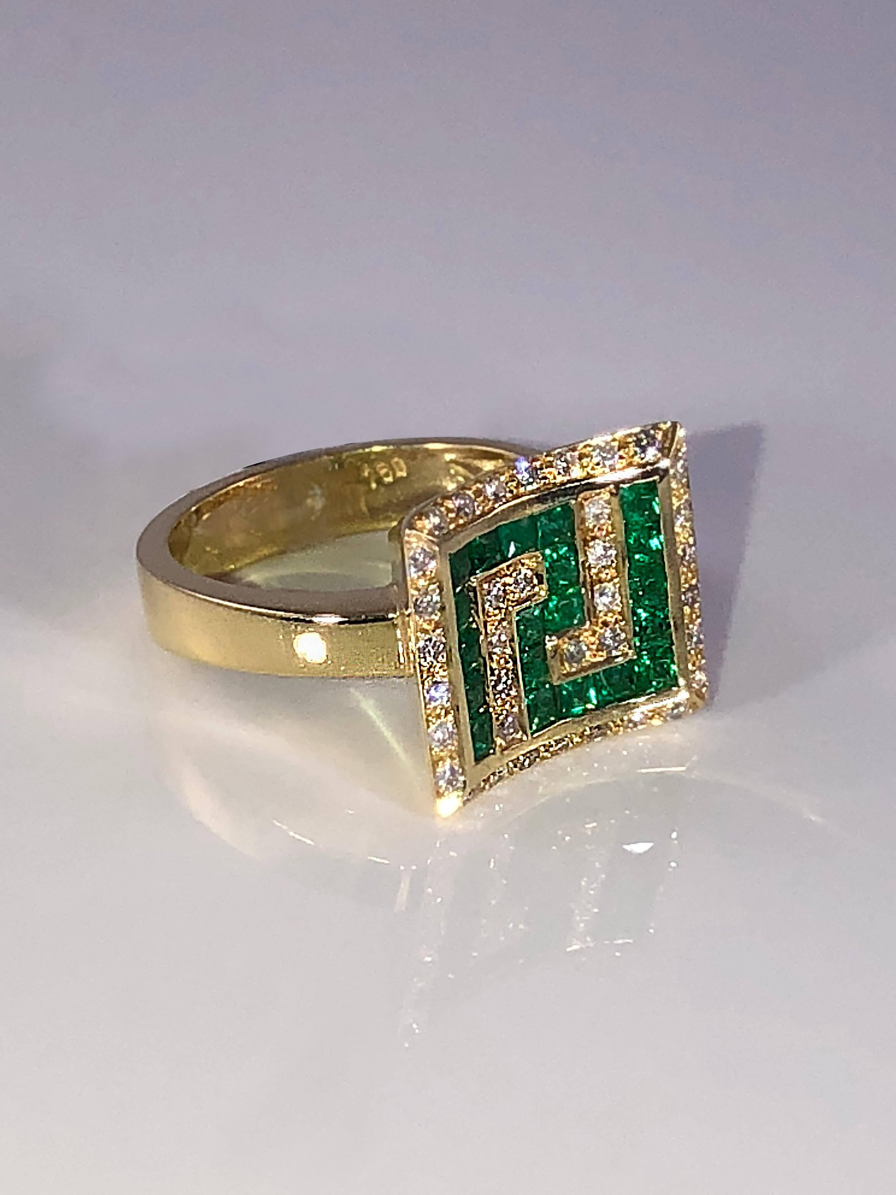 S.Georgios designer 18 Karat Yellow Gold Ring featuring the Greek Key design symbolizing eternity. It is all Hand Made and has Brilliant Cut White Diamonds total weight of 0.25 Carat, and Princess cut Emeralds total weight of 1.29 Carat. 
This