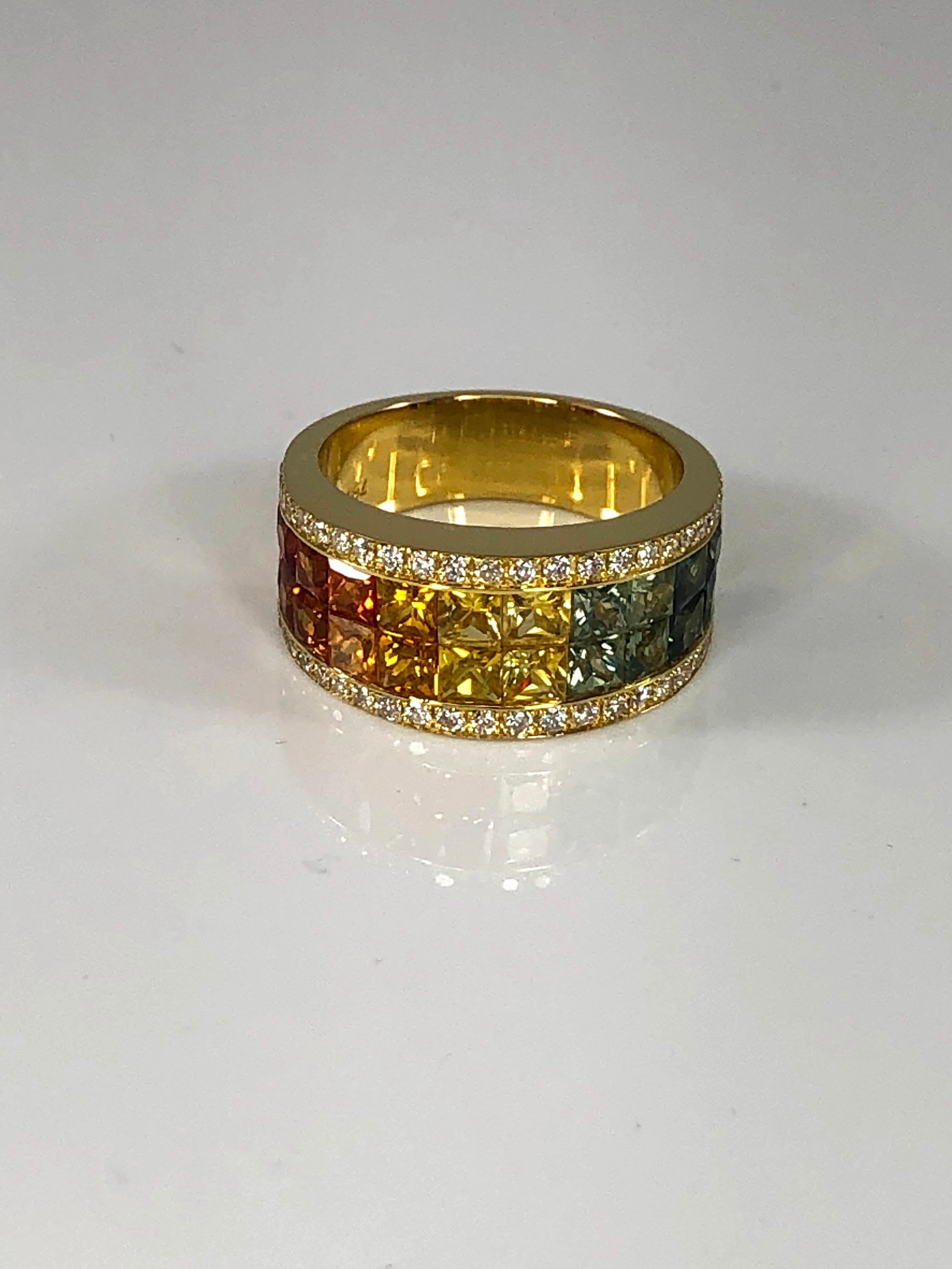 S.Georgios designer 18 Karat Yellow Gold Band Ring with two rows of invisible set Rainbow color Princess Cut natural Sapphires a total weight of 3.17 Carat and 0.40 Carat Brilliant Cut White Diamonds. 
This gorgeous ring is all custom made in our