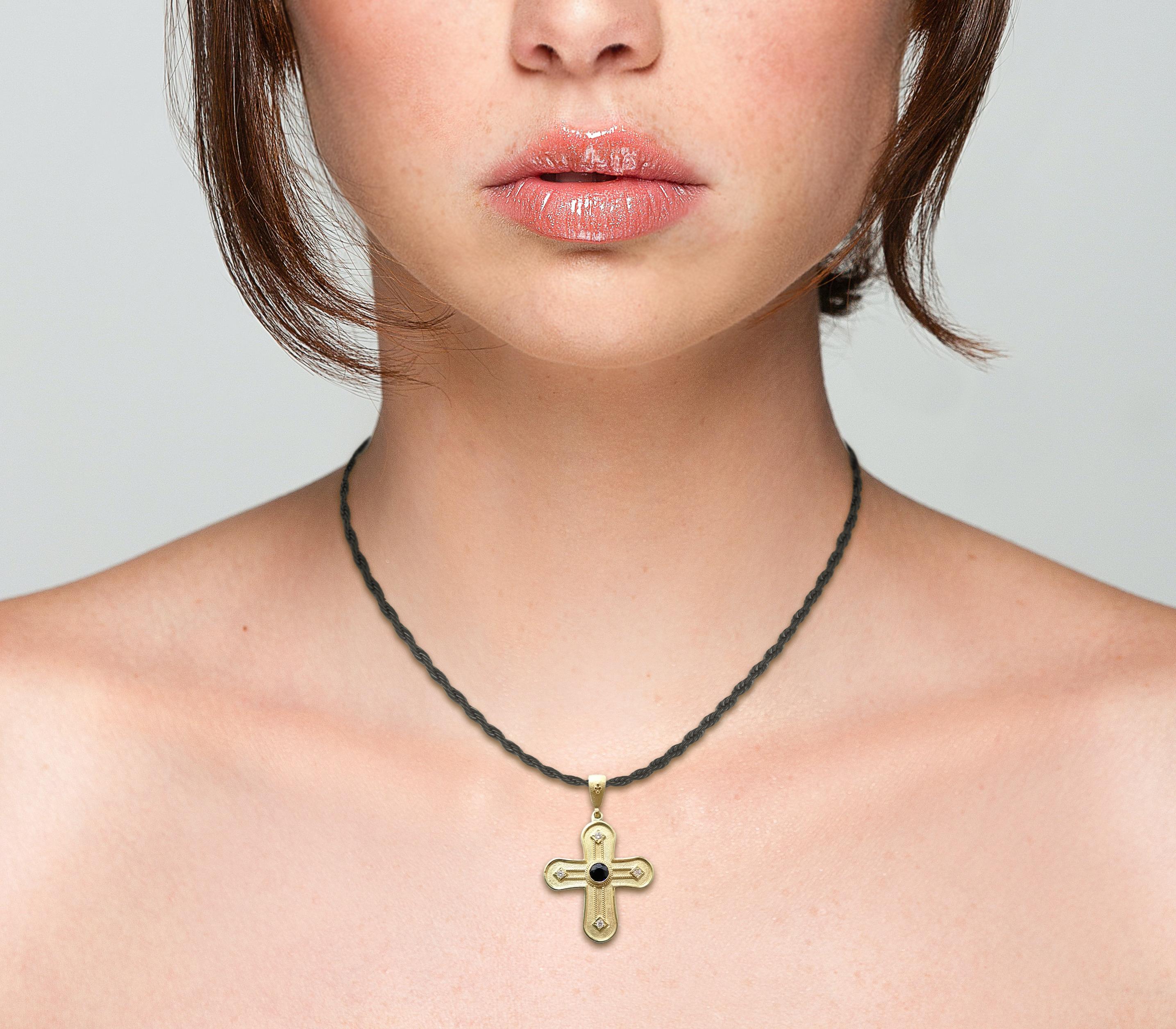 gold cross with sapphire