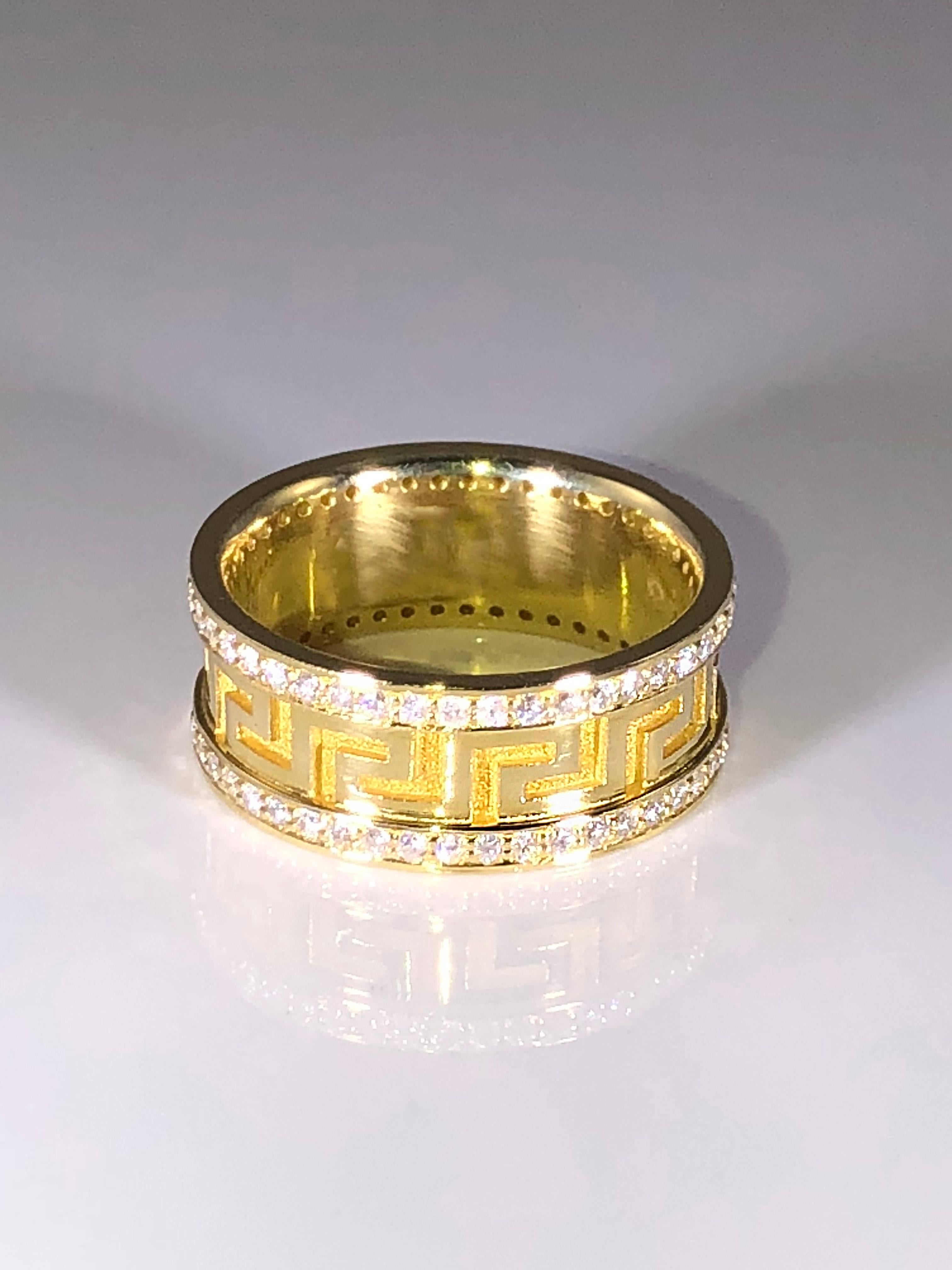 S.Georgios designer solid yellow gold 18 karat diamond band ring is all handmade and has the design of the Greek Key all the way around, which symbolizes eternal life, the most known and classic design in the world.
This gorgeous ring has a unique