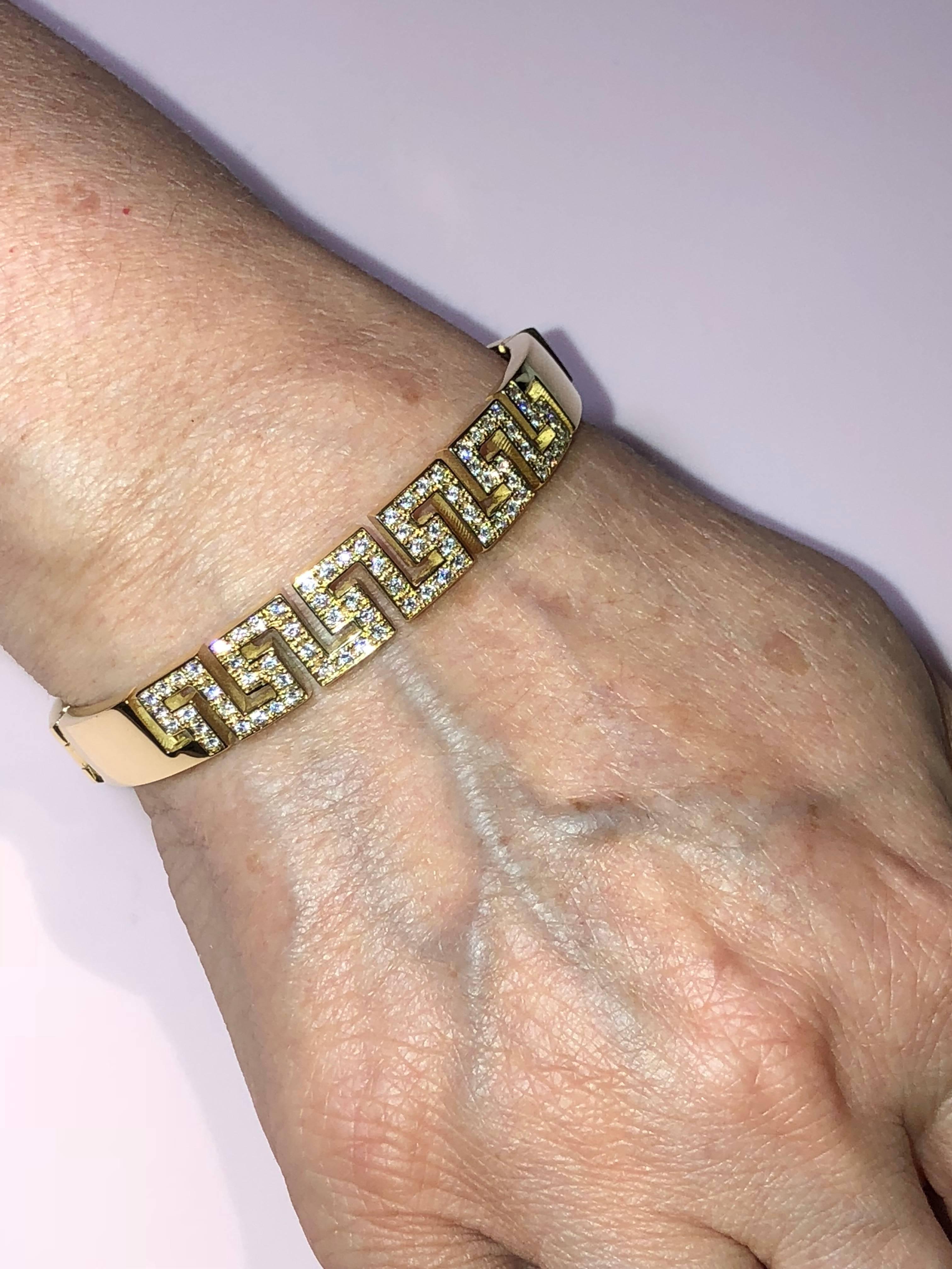 S.Georgios designer bracelet in solid yellow gold 18 karat all handmade with the Greek Key design, the symbol of eternal life. The Bracelet is custom made and has brilliant cut white diamonds total weight of 1.02 Carat and for more security, it has