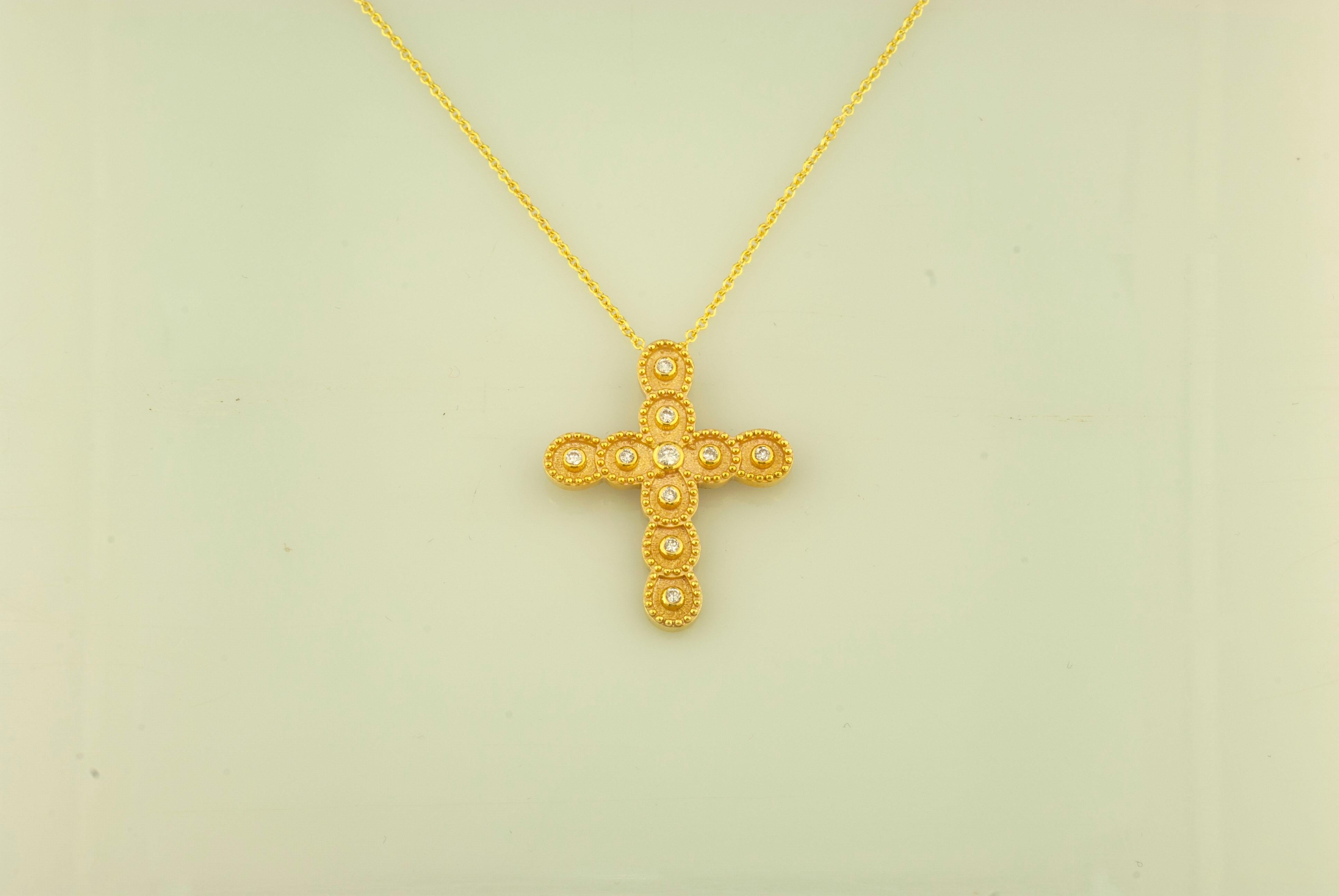 This S.Georgios designer 18 Karat Yellow Gold cross pendant necklace and chain is handmade with microscopically decorated Byzantine-style granulation work and is finished with a unique velvet background look. This beautiful cross pendant necklace