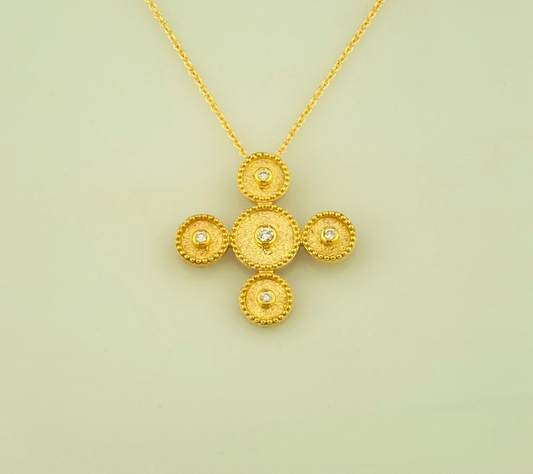 This S.Georgios designer 18 Karat Gold cross pendant necklace and chain is handmade with microscopically decorated Byzantine-style granulation work and is finished with a unique velvet background look. This gorgeous cross pendant necklace features 5