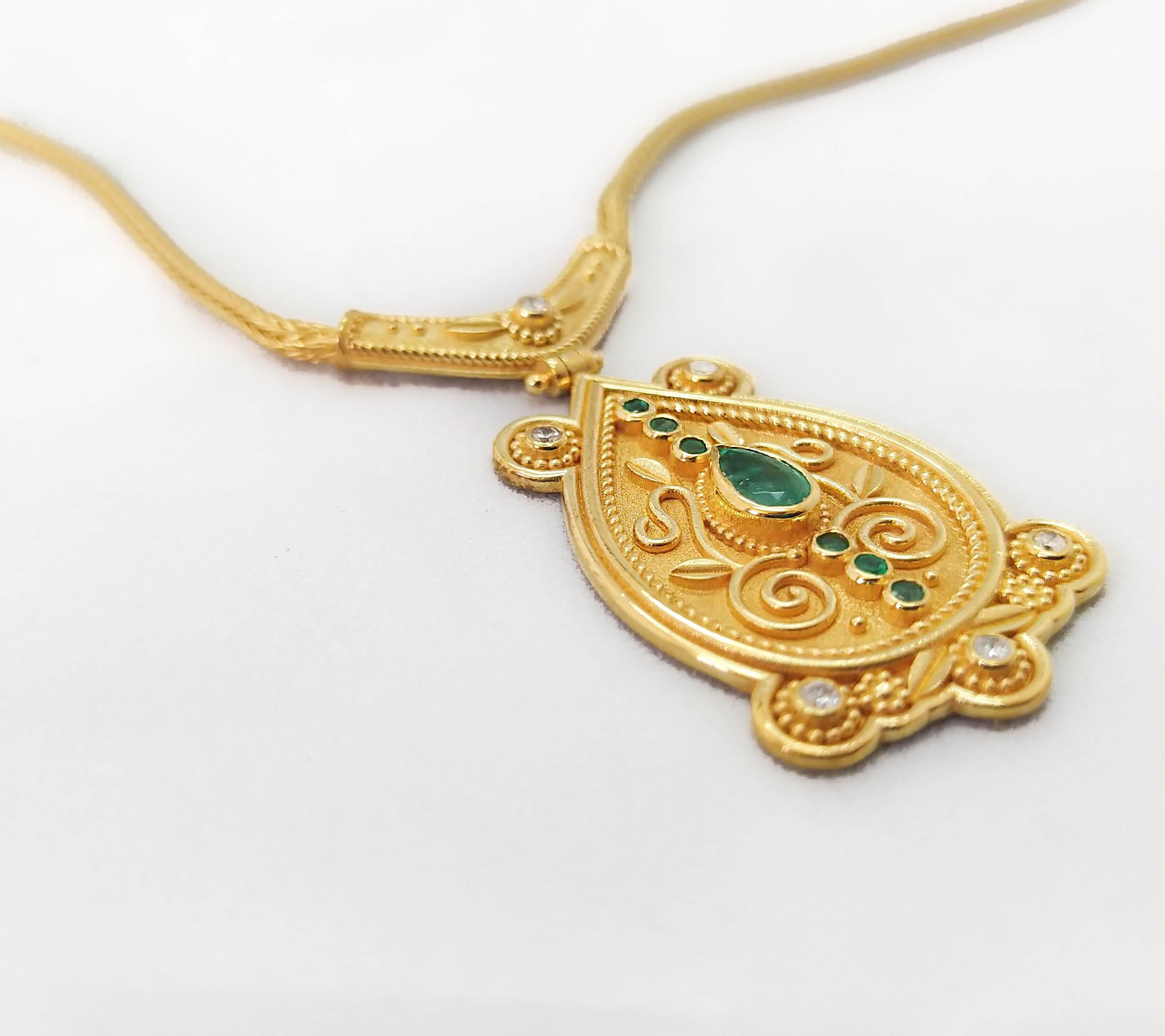 This S.Georgios designer 18 Karat Yellow Gold drop pendant Necklace is microscopically decorated with Byzantine-style bead and wire granulation workmanship and finished with a unique velvet background look. This gorgeous pendant necklace showcases a