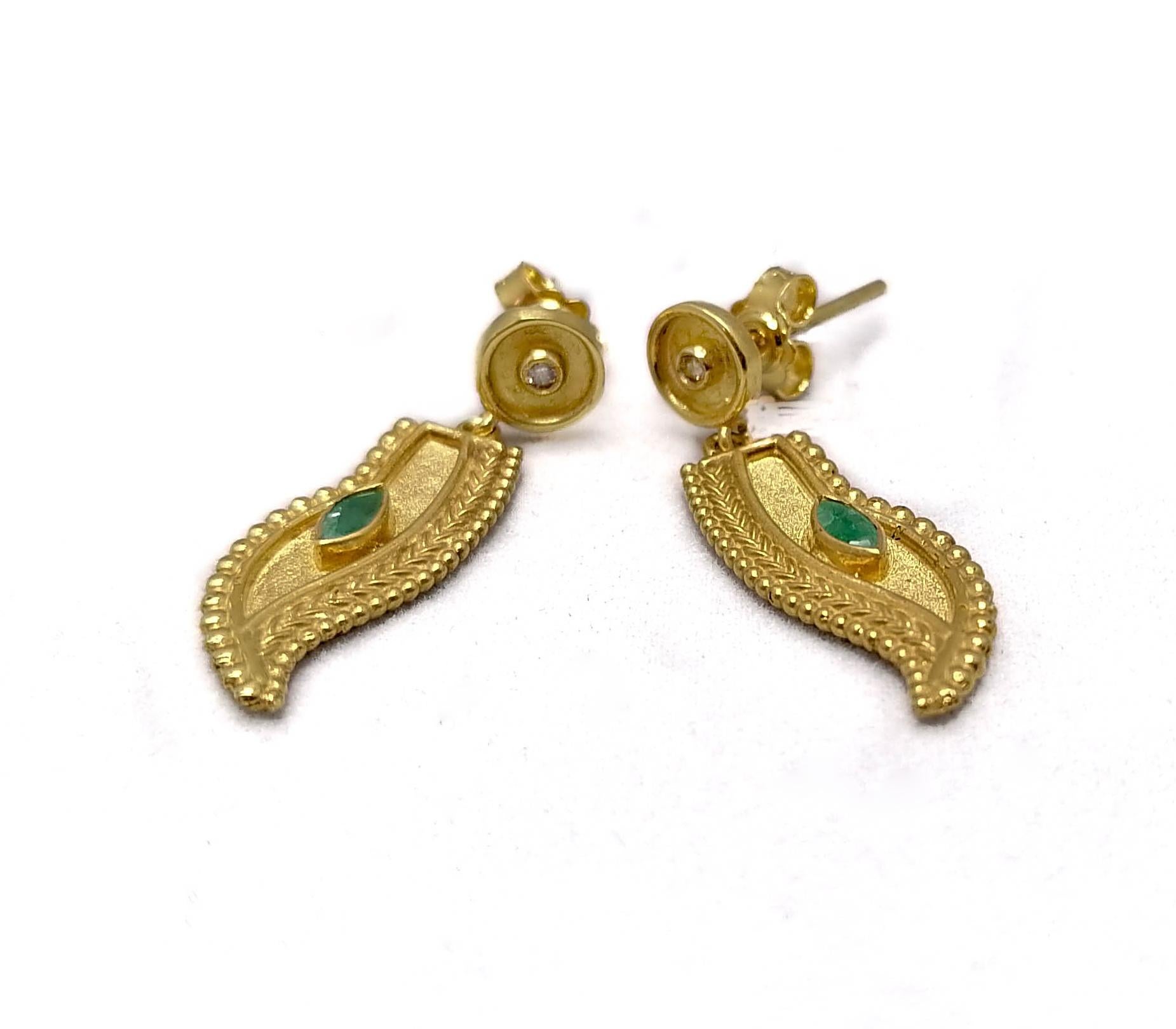 These S.Georgios 18 Karat Yellow Gold designer earrings are hand made and decorated with Byzantine-era style bead granulation workmanship, and finished with a unique velvet background look. These beautiful feather design earrings feature 2