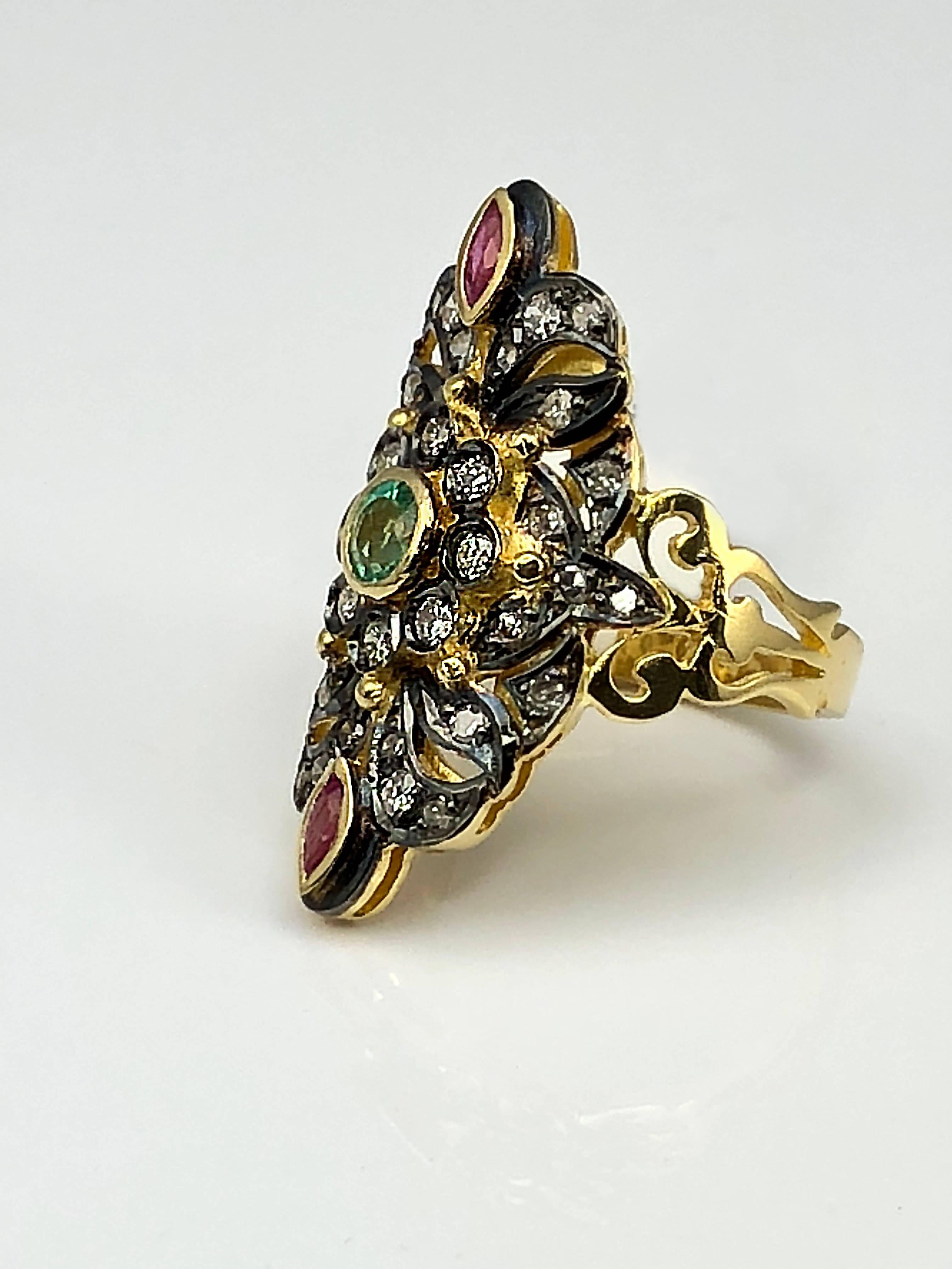 S.Georgios Designer all Hand Made 18 Karat Yellow Gold Ring decorated with Byzantine-era style granulation and a combination of Diamonds, Rubies, and Emerald. The stunning ring is richly decorated and the Black Rhodium areas give it its unique look.