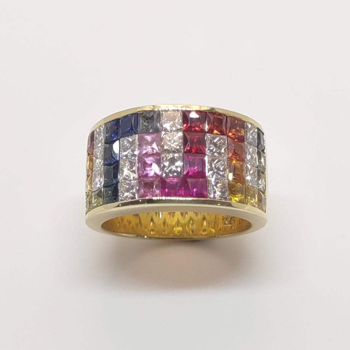 S.Georgios designer 18 Karat Yellow Gold Band Ring with 4 rows of invisible set Rainbow color Princess Cut natural Sapphires a total weight of 3.47 Carat and 1.58 Carat Princess Cut White Diamonds. The gems are set in a way that the Sapphires create