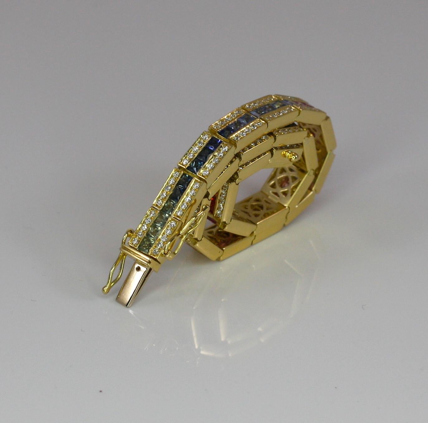 S.Georgios designer is presenting 18 Karat Solid Yellow  Gold Bracelet with a row of an invisible set Rainbow color Princess Cut Sapphires of the total weight of 8.80 Carat and 1.80 Carat Brilliant Cut White Diamonds on the sides. Bracelet is made