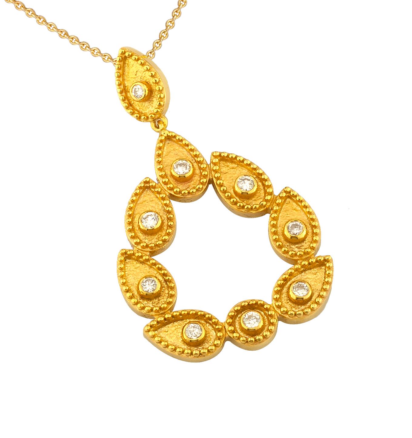 S.Georgios designer Teardrop chain pendant necklace is 18 Karat yellow gold and microscopically decorated with hand-made bead granulation workmanship, and finished with a unique velvet background look. This beautiful wreath necklace features 9