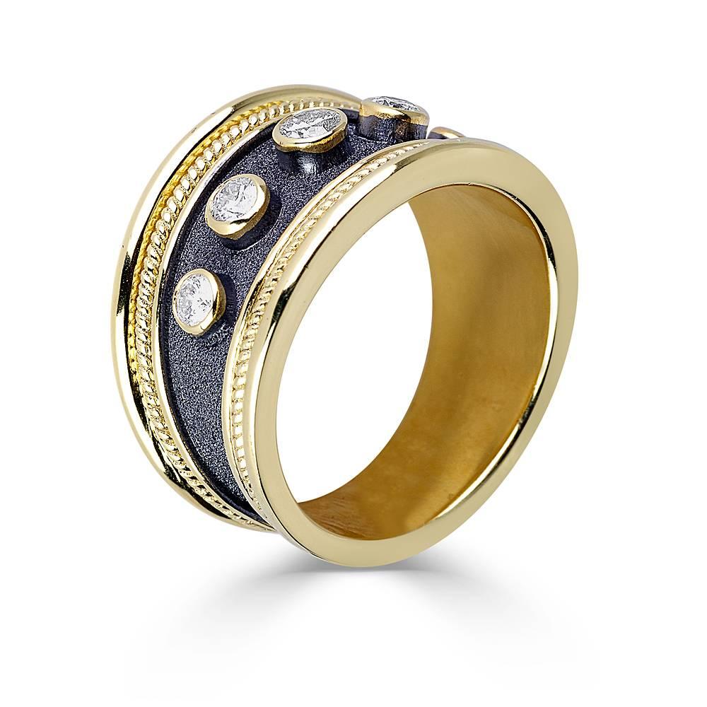 S.Georgios designer unisex ring is handmade in solid 18 Karat Yellow Gold and is microscopically decorated with Byzantine granulation workmanship and brilliant-cut white diamonds total weight of 0.40 carat. The gorgeous ring features a unique velvet