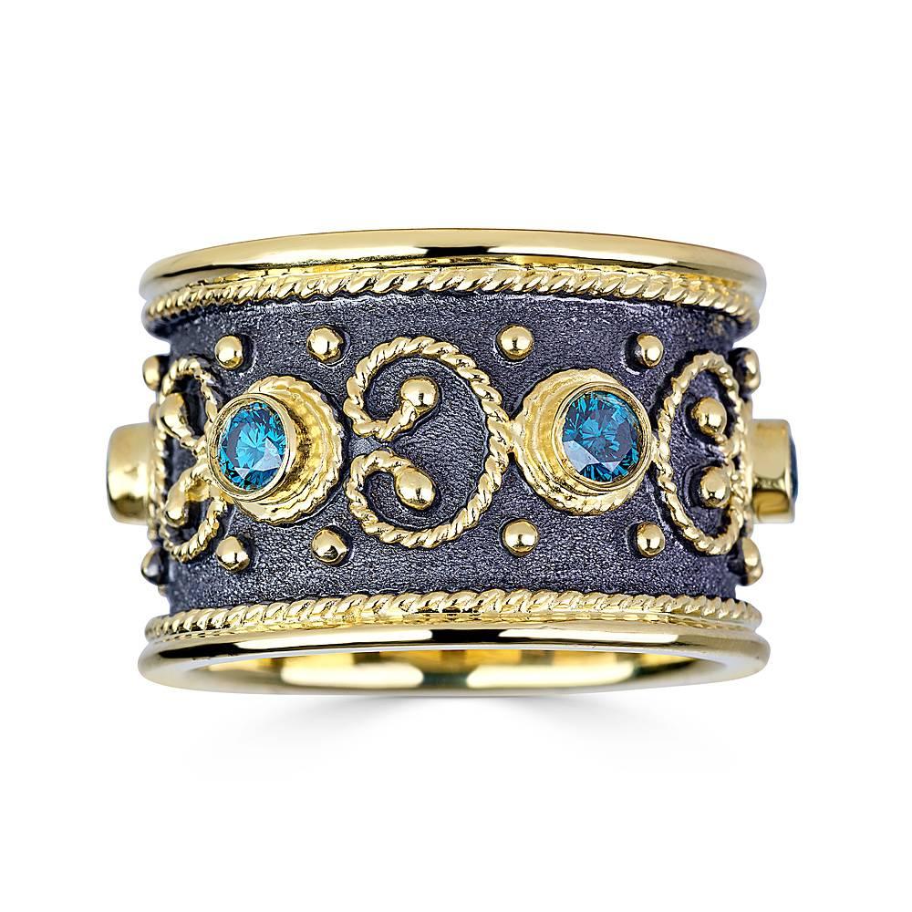 S.Georgios designer ring is handmade from solid 18 Karat Yellow Gold and is microscopically decorated all the way around with gold beads and wires shaped like the last letter of Greek Alphabet - Omega, which symbolizes eternal life. The Black Velvet