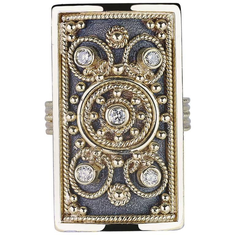 S.Georgios designer Ring Hand Made in 18 Karat Yellow Gold and Black Rhodium. This rectangular ring is microscopically decorated with 22 Karat Gold granulation work in Byzantine style and with a unique velvet look on the background. The ring