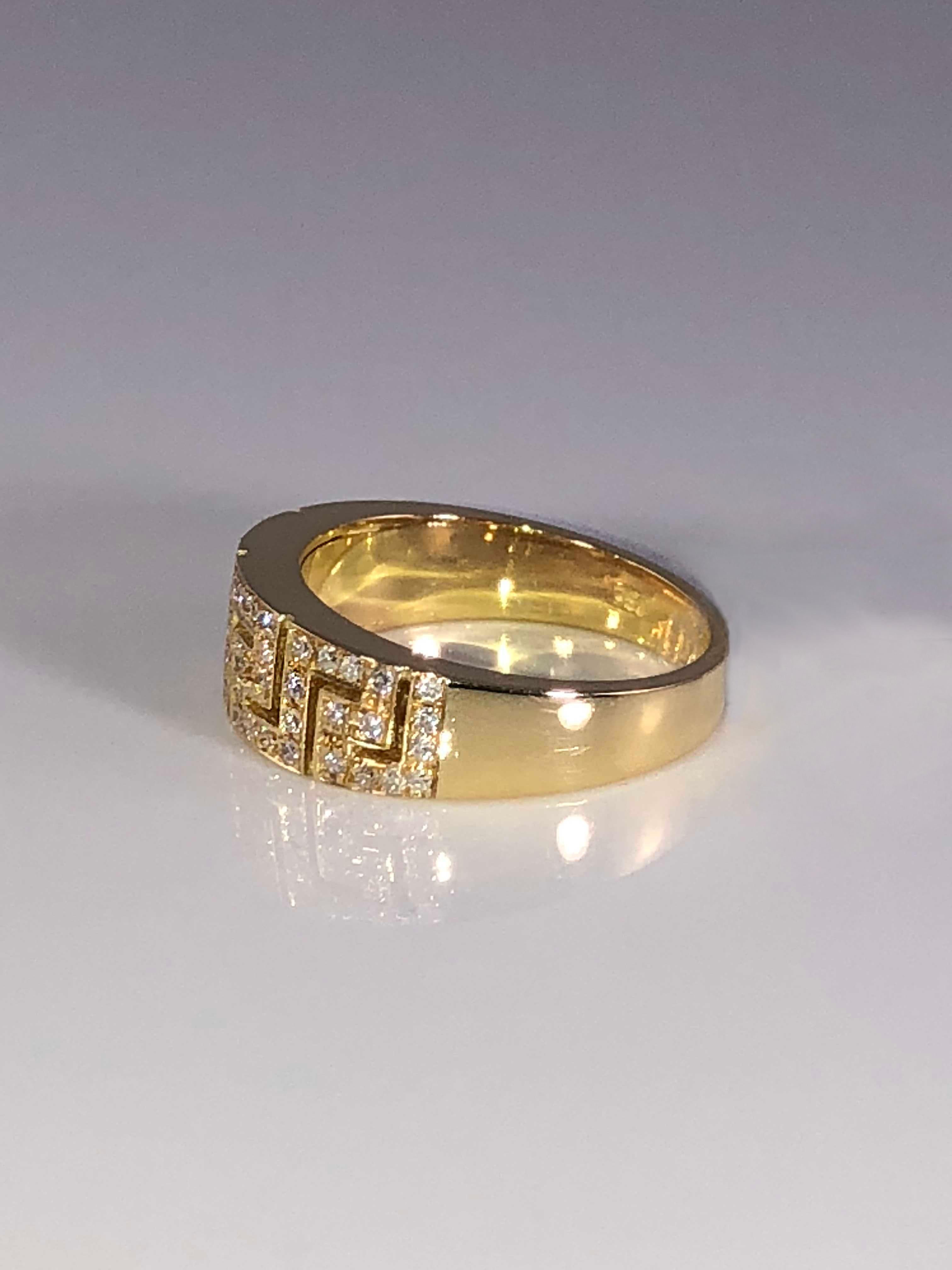 S. Georgios designer 18 Karat Yellow Gold Hand Made Diamond Ring with the Greek Key design that symbolizes eternity all custom-made. It is known as the symbol of long life and is one of the most classic designs in the world.
The beautiful ring is