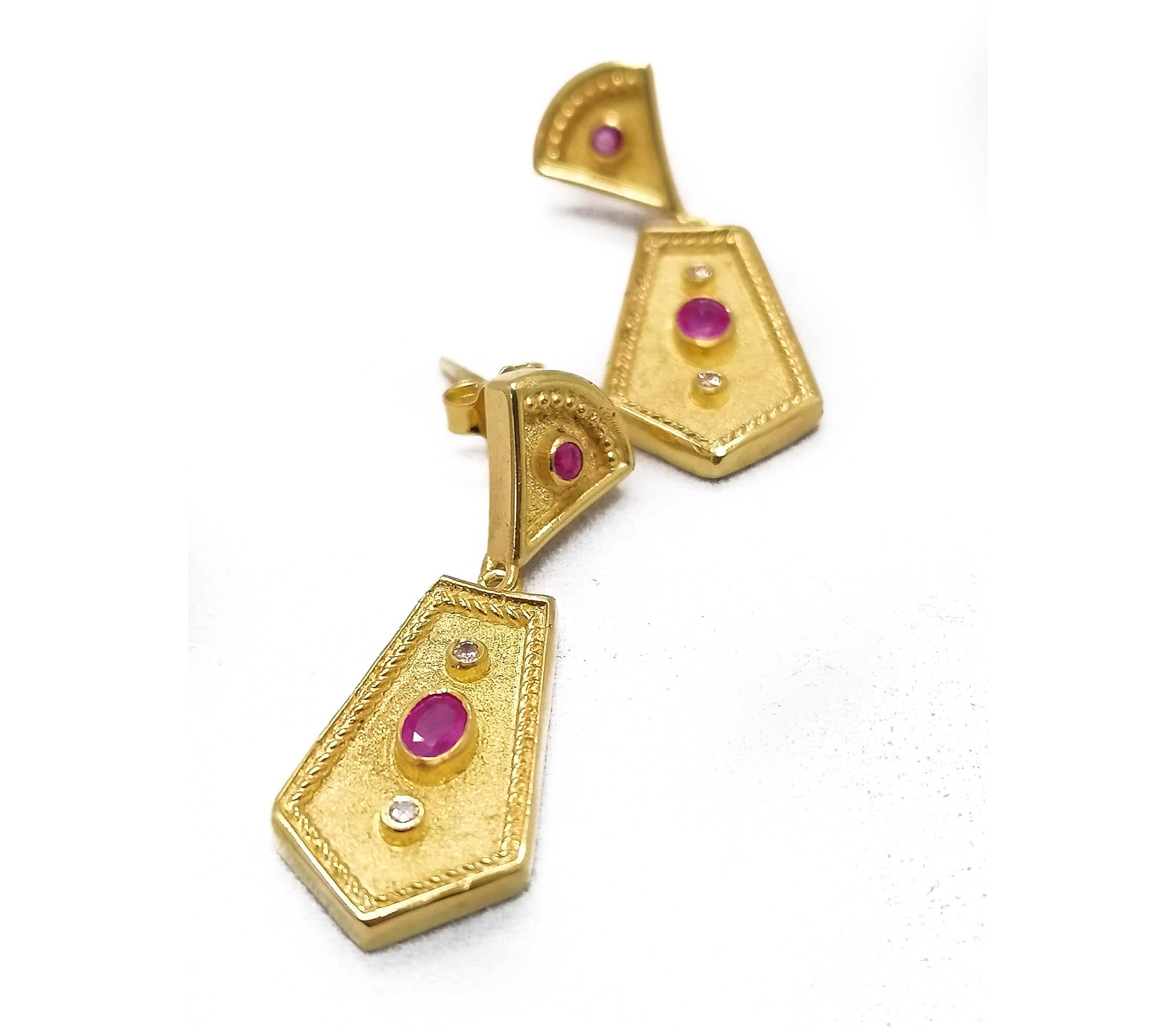 These S.Georgios designer Etruscan-style gorgeous earrings are hand made from 18 Karat Yellow Gold and decorated with granulation workmanship done under a microscope. These beautiful earrings feature 4 natural Rubies, 2 Oval-cut and 2 brilliant-cut,