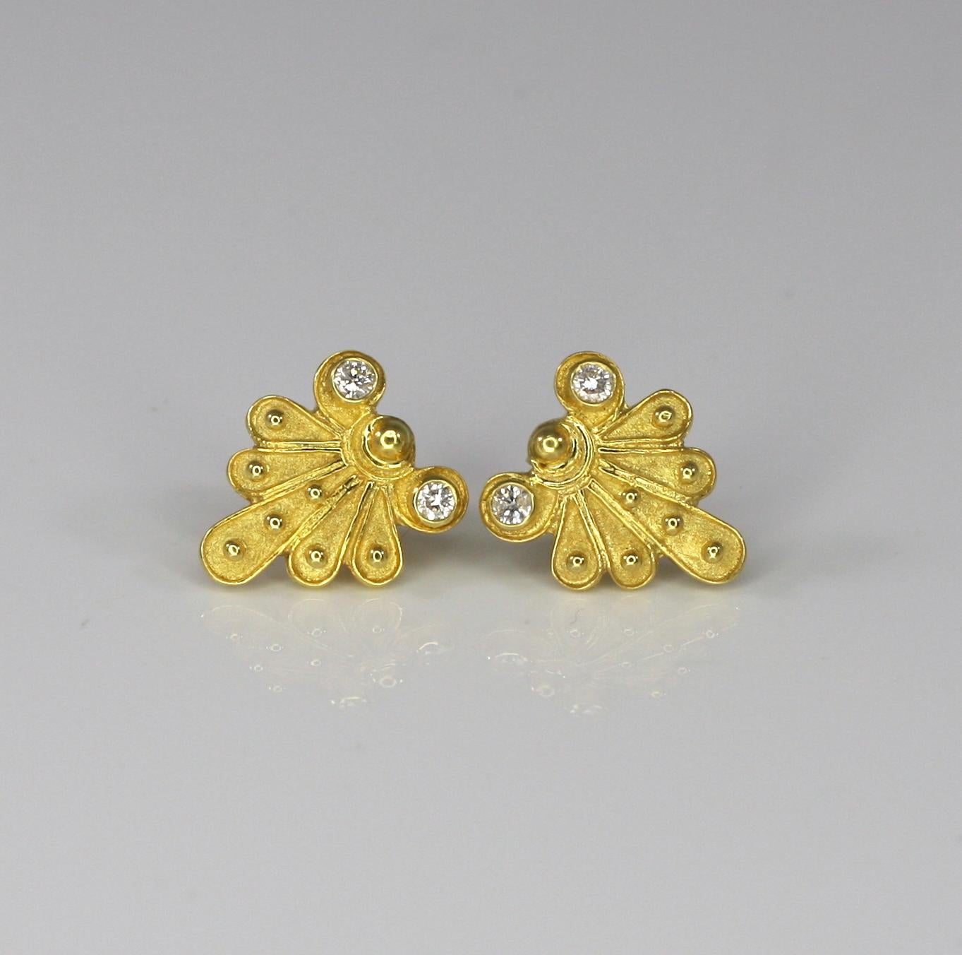 This S.Georgios designer Earring is 18 Karat yellow gold all handmade. The earrings are microscopically decorated with granulation workmanship and feature the unique velvet look on the background. These earrings carry 4 Brilliant cut Diamonds total