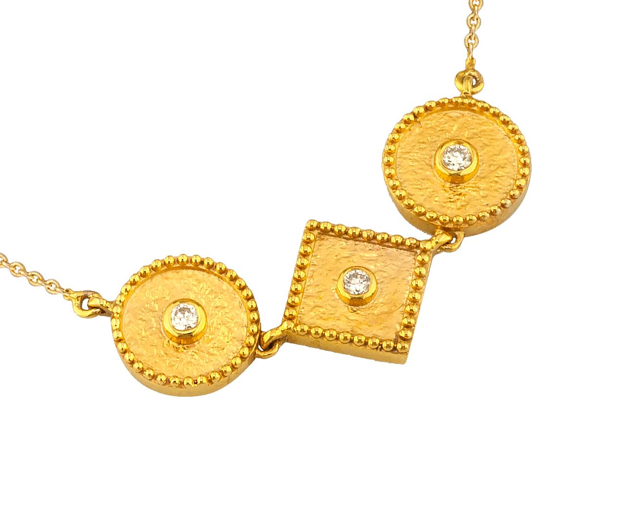 This S.Georgios necklace is 18 Karat yellow gold and microscopically decorated with hand-made bead granulation workmanship, and finished with a unique velvet background look. This beautiful geometric necklace feature 3 brilliant-cut White Diamonds,