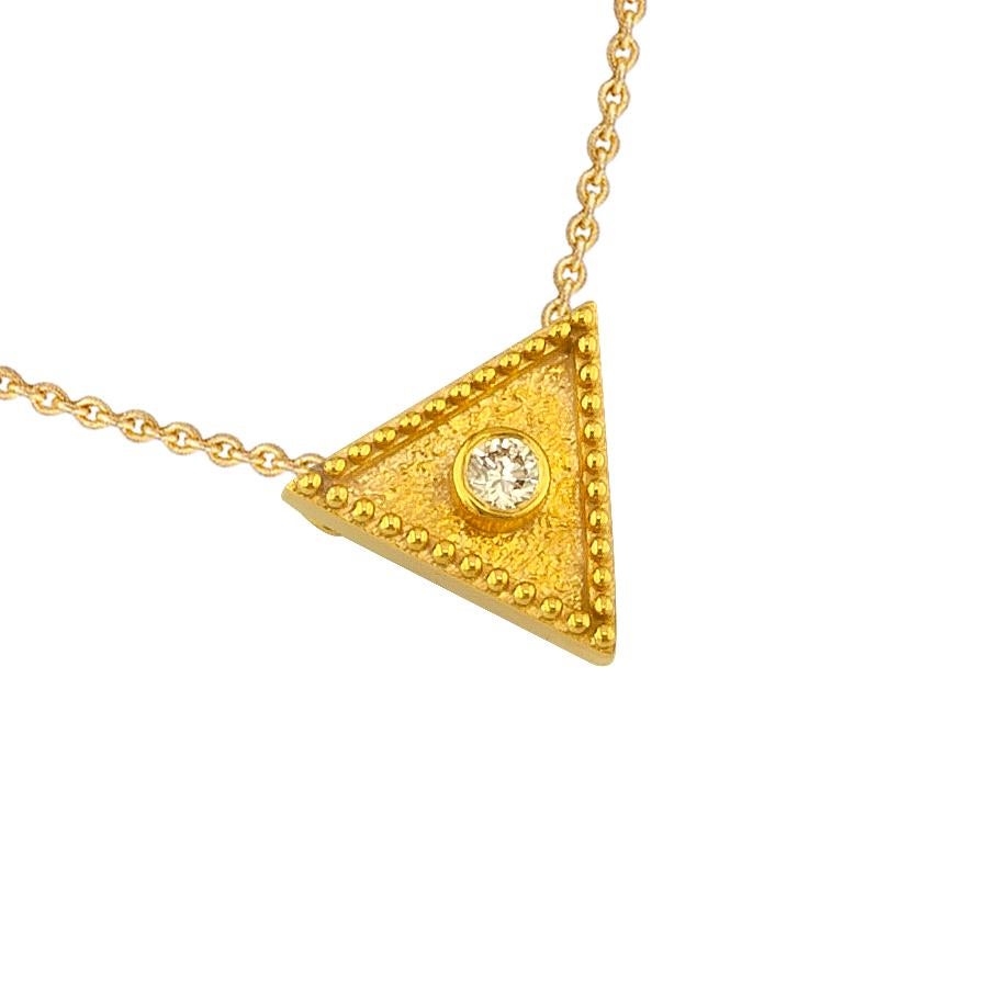 S.Georgios designer necklace is 18 Karat yellow gold and microscopically decorated with hand-made bead granulation workmanship, and finished with a unique velvet background look. This beautiful triangle necklace features a brilliant-cut White