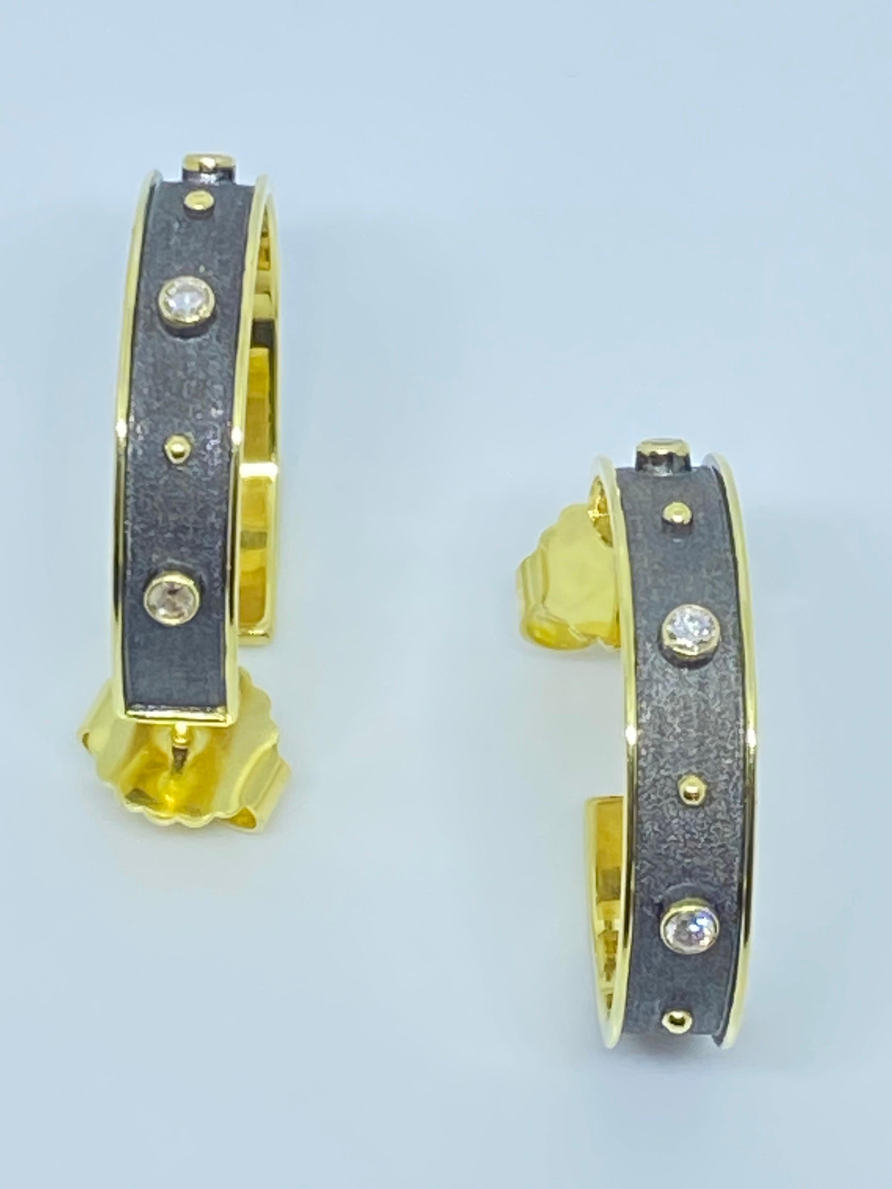 These S.Georgios designer earrings are hand made from 18 Karat Yellow Gold with granulation workmanship and are finished with a unique velvet background and Black Rhodium to create a Stunning two-tone look. This gorgeous pair feature 6 Brilliant cut