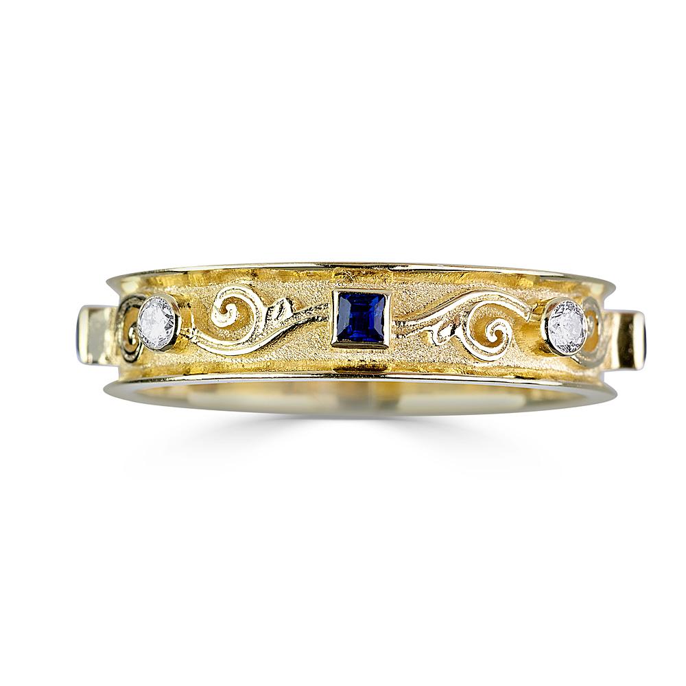 S.Georgios Designer Ring is all handmade from solid 18 Karat Yellow Gold and custom-made. The gorgeous ring is microscopically decorated all around with gold beads and wires - granulation work symbolizing the Greek Key design. This Unique band