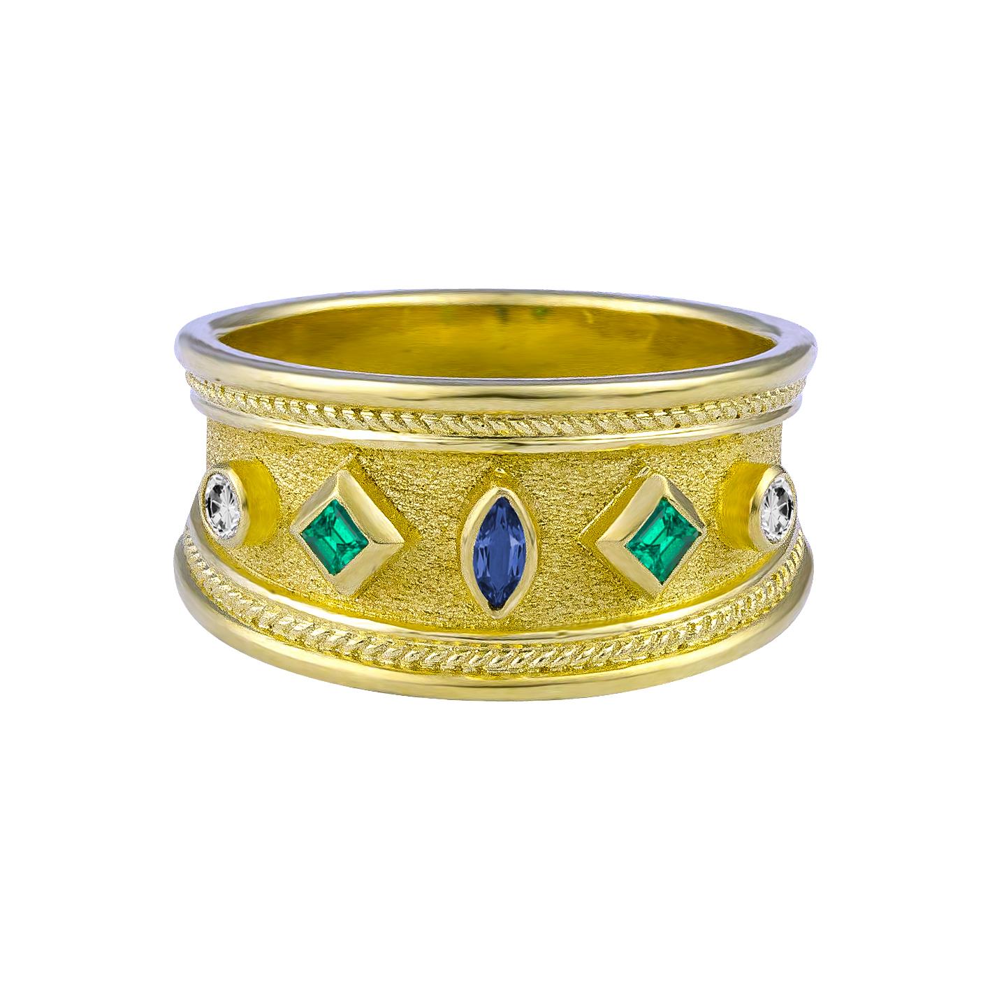 S.Georgios designer 18 Karat Solid Yellow Gold Ring all handmade with Byzantine granulation workmanship and a unique velvet background. The ring has a center 0.10 Carat Marquise Sapphire, 2 Emeralds total weight of 0.15 Carats and 2 Brilliant cut