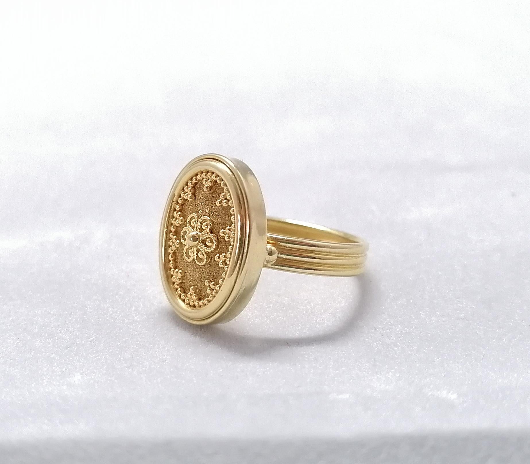 This elegant S.Georgios designer oval ring is handmade from solid 18 Karat Yellow Gold. This gorgeous oval ring is microscopically decorated with Byzantine-style granulation work to create a stunning and delicate floral art piece.
We also make this