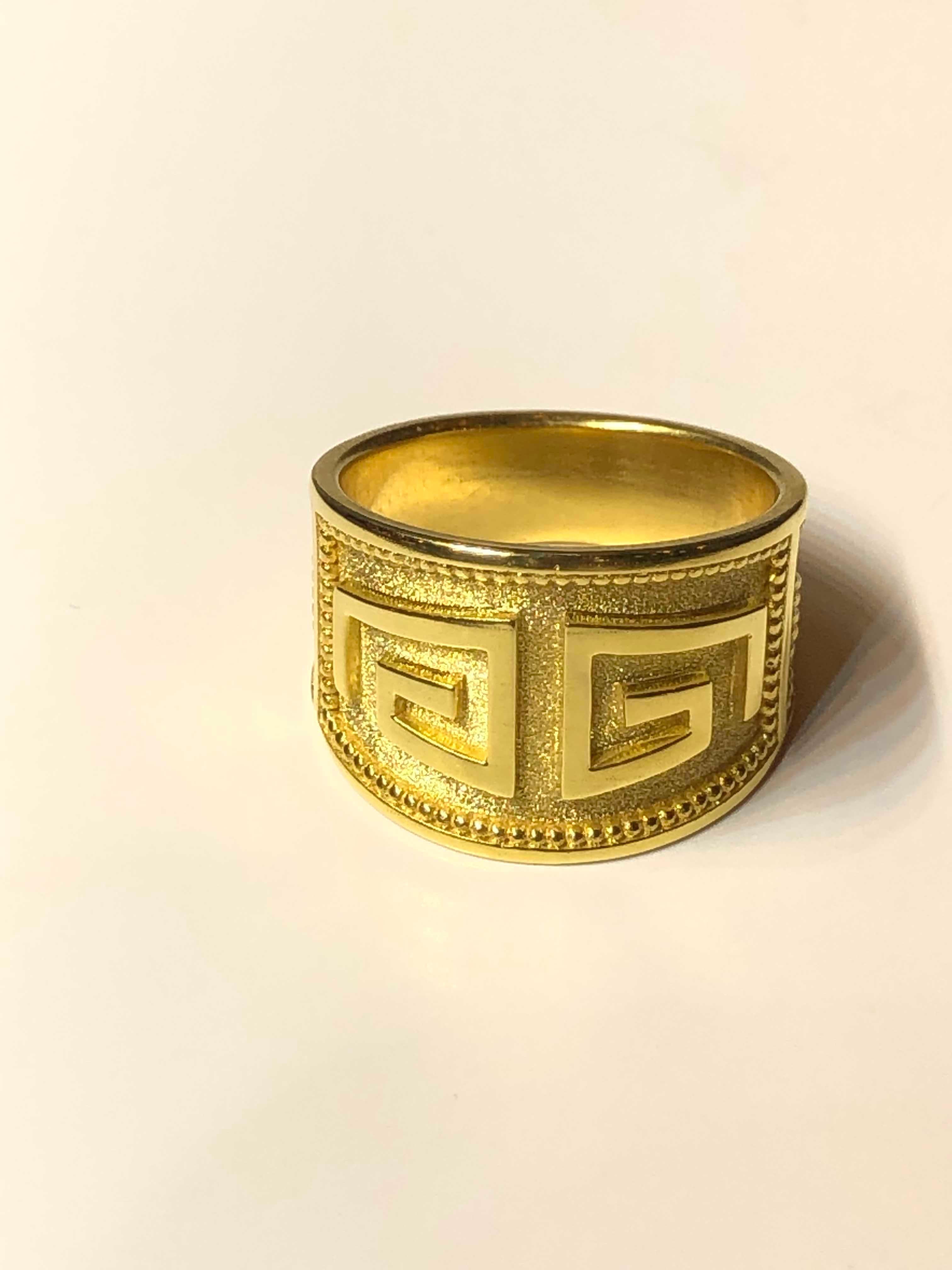 S.Georgios designer ring in solid 18 Karat Yellow Gold all handmade with the Greek Key design, the symbol of eternal life and granulation. 
All Georgios Collections pieces are of outstanding quality, workmanship, and the stone selection and are all
