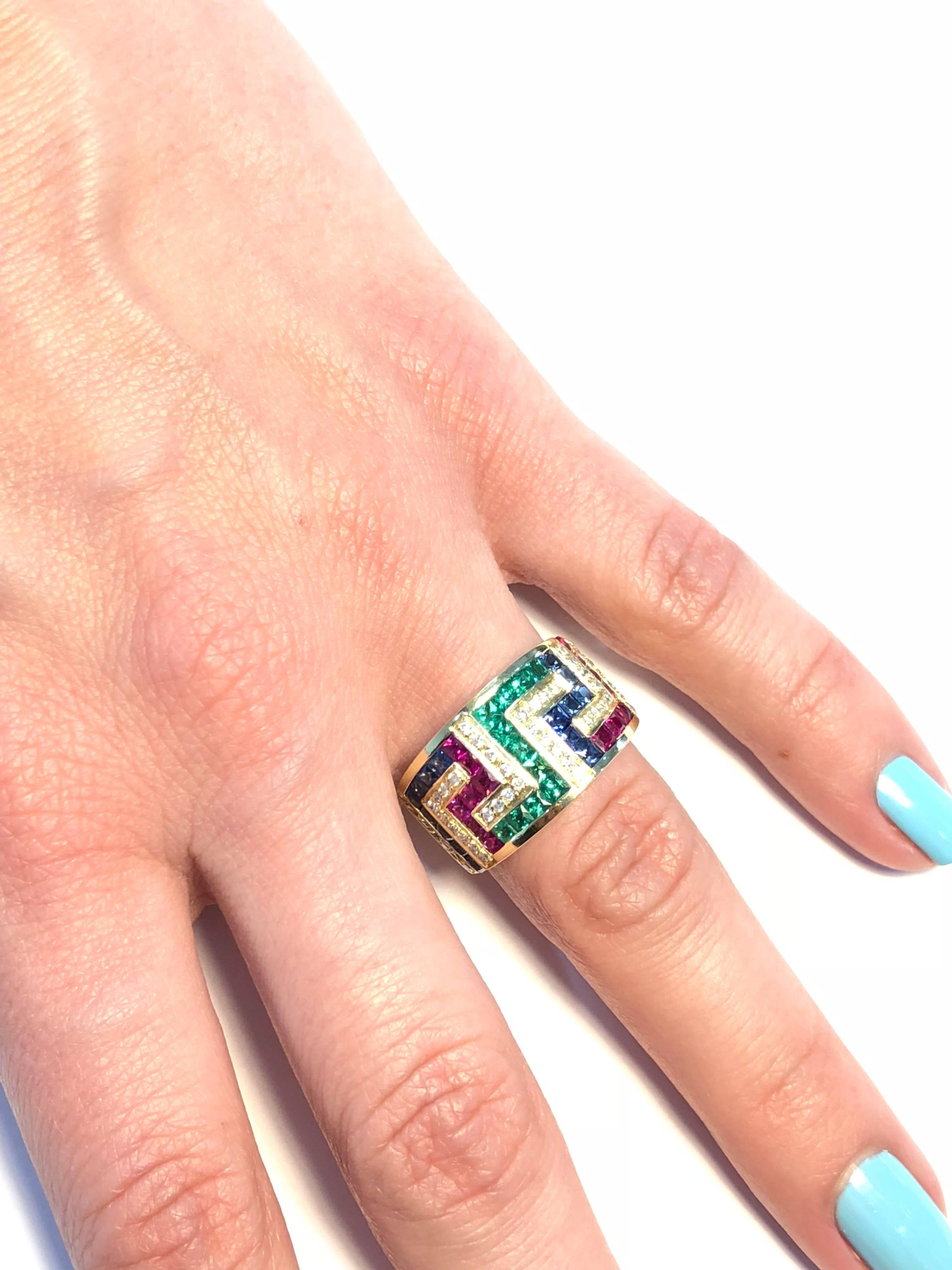 S.Georgios designer 18 Karat Yellow Gold Ring all Hand Made featuring the Greek Key design symbolizing eternity. The Ring features Brilliant Cut White Diamonds total weight of 0.40 Carat, Princess cut Rubies, Sapphires and Emeralds total weight of