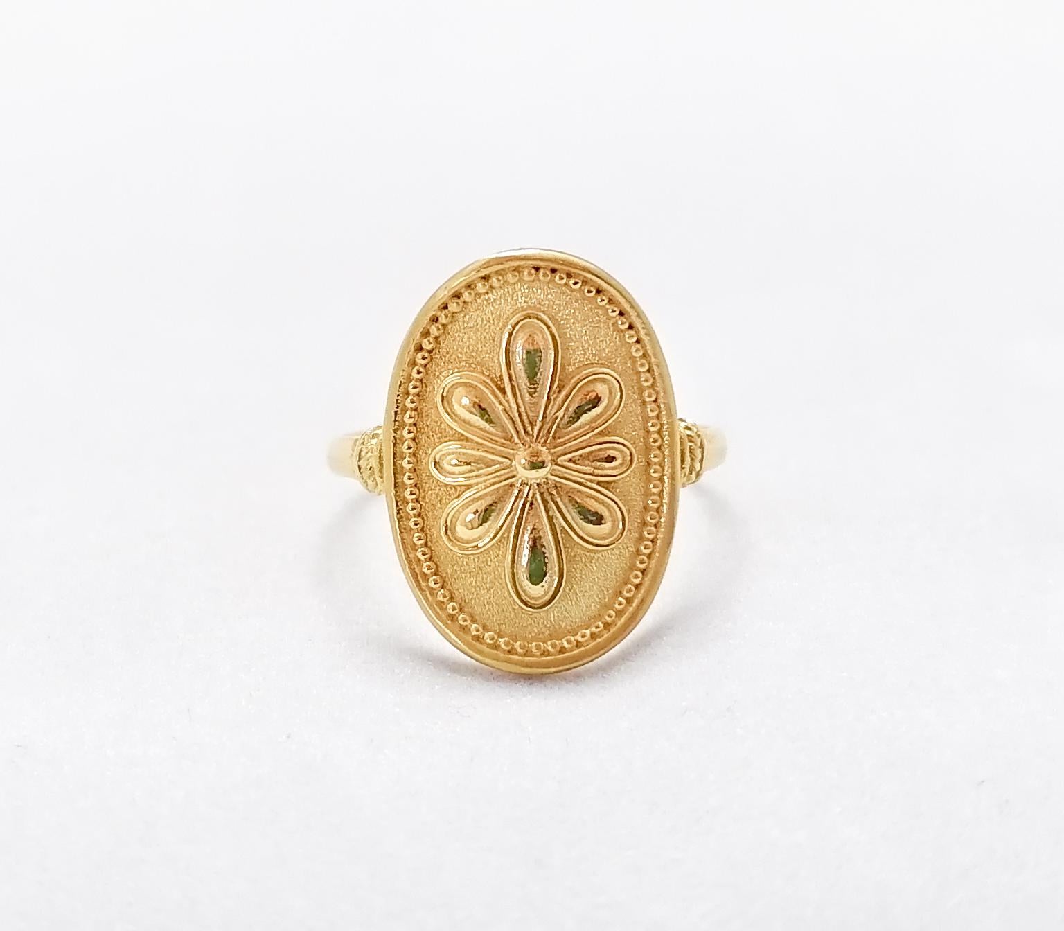 S.Georgios designer ring is handmade from solid 18 Karat Yellow Gold. This gorgeous oval ring is microscopically decorated with Byzantine-style granulation work to create a stunning and elegant floral art piece.
We also make this beautiful ring in