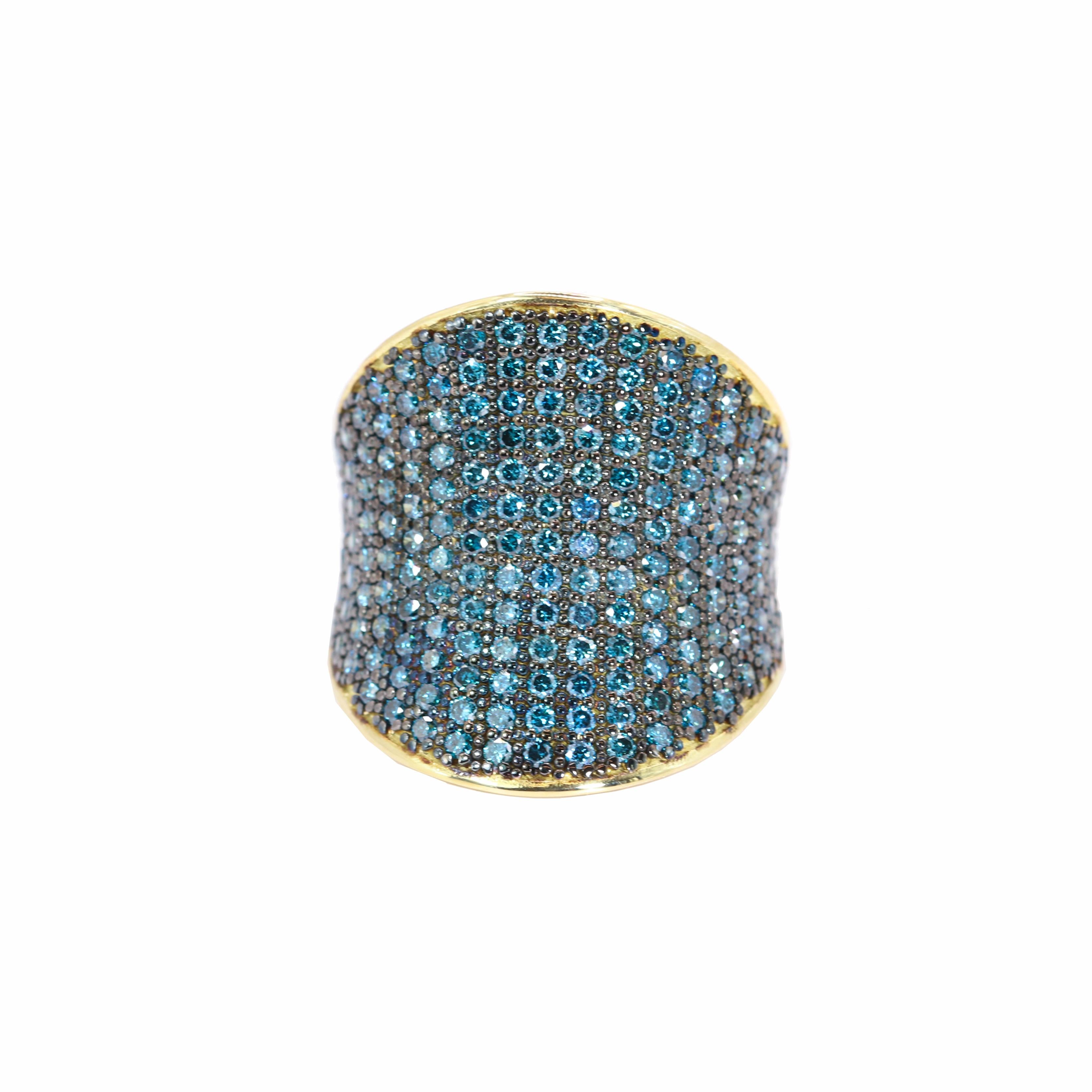 S.Georgios designer presents a luxurious 18K Yellow Gold Ring adorned with 2,40 carats of stunning pavé-set Blue Diamonds. This dazzling piece, meticulously handcrafted in Athens, Greece, radiates opulence and sophistication. The intricate pavé