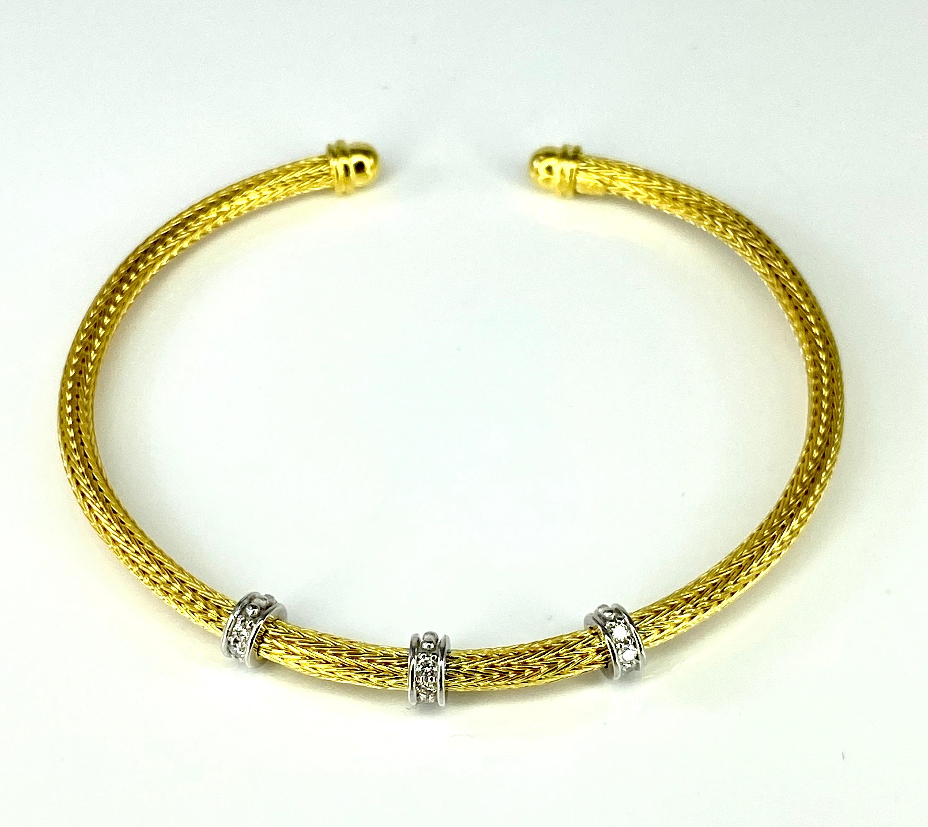 This is S.Georgios designer rope bracelet knitted from 18 Karat yellow gold threds in our workshop in Greece. This all custom-made flexible bangle bracelet is decorated with white gold and white brilliant cut diamonds with a total weight of 0.18
