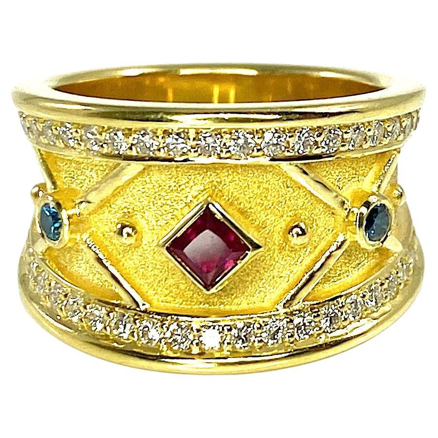 Georgios Kollektionen Ring aus 18 Karat Gelbgold mit Rubin und blauen und weißen Diamanten 