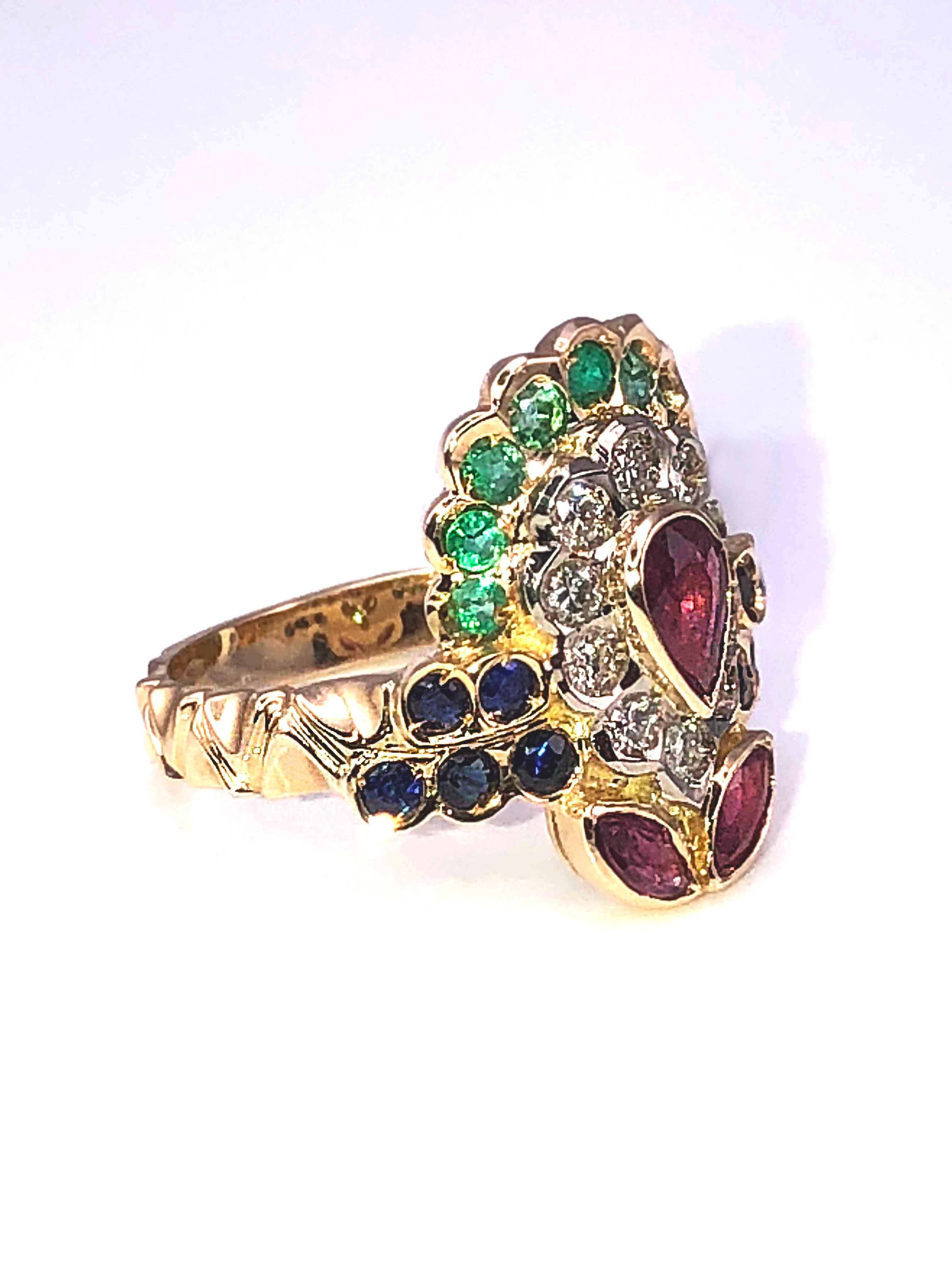 S.Georgios design ring handmade from solid 18 Karat Yellow Gold. This Multicolour Byzantine style ring features 10 Brilliant cut Diamonds in a total weight of 0.32 Carat, center Pear Shape Ruby, 2 Marquize Cut Rubies,  10 Brilliant Cut Sapphires and