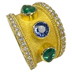 Anello con zaffiro e smeraldo in oro giallo 18 carati Georgios Collections