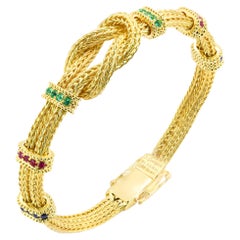 Georgios Kollektionen Armband aus 18 Karat Gelbgold mit Saphiren, Smaragden und Rubinen