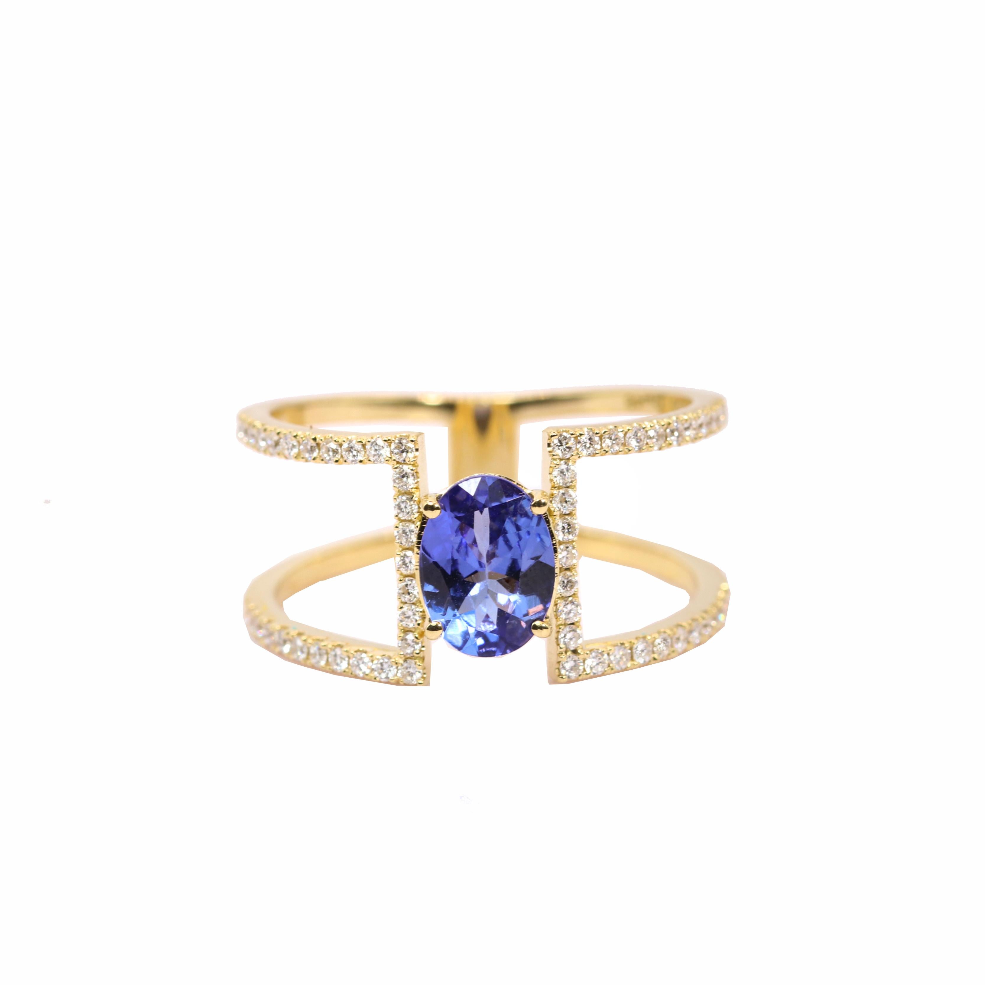 S.Georgios designer presents an exquisite 18K Yellow Gold Ring featuring a captivating 1.16-carat oval Tanzanite gemstone as its centerpiece, the design unites two sleek bands with the brilliance of the stone.Accentuated by 0.36 carats of shimmering