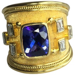 Georgios Collections Anillo de oro amarillo de 18 quilates con tanzanita talla cojín y diamantes